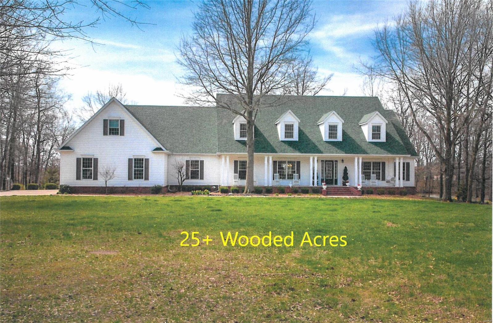 STATELY COLONIAL offers 25+ ac of PARAMOUNT PRIVACY! Rich hardwood flooring greets you at the entry & flows through most of the main level. Dramatic 2 story great room w/gas fireplace & panoramic windows w/views of the 1 ac stocked lake & picture-perfect sunsets. Work remotely from your main floor home office (or 5th BR). Chef inspired kitchen features deluxe cabinetry, center island, & walk-in pantry. Retreat to the phenomenal principal suite w/spa-like BA & 13x8 walk-in closet. Upper level has 2ND MASTER SUITE, 2 WALK-IN CLOSETS & 3/4 BA. Main floor laundry w/2 washers & dryers. Various entertainment possibilities in the finished walk-out lower-level w/rec/game room, media area, 4th BR & 3/4 BA. EXPANSIVE 48X80 HEATED OUTBUILDING will accommodate any & all your hobby necessities. Delight in this one of a kind property that provides the wildlife, fishing, ATV trails, & hunting. Making memories start here. See additional list of custom features & amenities. Agent related to seller.