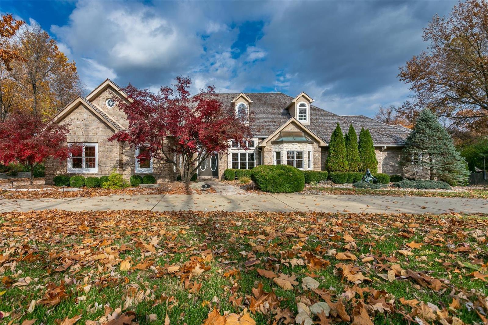 Prepare yourself for a one-of-a-kind home, situated in a beautiful sprawling setting – the picture of everything you expect from an estate. A private setting on a cul de sac, the home is better described as a custom-built mansion. The Sunset Hills Country Club and golf course is at the entry to this spectacular property. Over 6600 sq. ft. of living area that is fit for this ultimate dream home. An outdoor kitchen complements the pool and 3000 sq. feet of decking and patio leading to an amazing oversize pool. Double staircases to both the second floor and the basement allow easy access for parties and gatherings. Did we mention it has a wine cellar and bar for a special collection? The master bath contains a 21 by 16 stand-up shower as well as a jetted tub. Four gas fireplaces will keep you cozy on cool mornings. This house sits on 9.31 acres, allowing for privacy and security. Recent improvements include a $45,000 retaining wall, a $50,000 deck, and a $60,000 new cedar shake roof. Additional Rooms: Wine Cellar