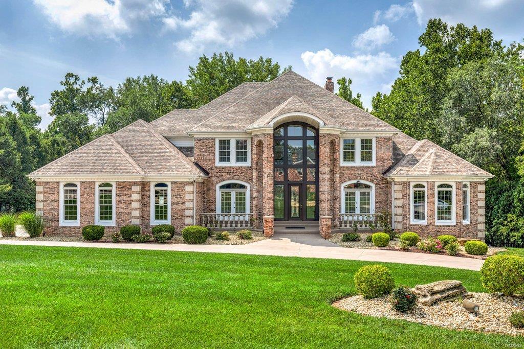 Exceptional craftsmanship & distinctive design elements define this extraordinary 8200 sq ft Estate home. 2-Sty marble foyer highlighted by dramatic floating staircase leads to elegant dining room & stunning great room with marble fireplace flanked by built-in bookcases & expansive wall of windows. Spacious open kitchen featuring 42” white cabinetry, premium appliances & butterfly center island adjoins light-filled breakfast room & hearth room with brick fireplace. Coffered primary bedroom suite radiates warmth with a marble fireplace, wide bay window, luxury bath with jetted tub & adjacent study with custom built-ins. Front & rear staircases access 3 additional ensuite bedrooms. Lower Level includes recreation room with wet bar & 3rd fireplace, media room, game room & bonus room plus office & guest suite. Situated on a 1.7-acre lot with wrap around deck with gazebo, patio with wet bar, hot tub & pool with waterfall. A geothermal system functions to significantly reduce utility bills.