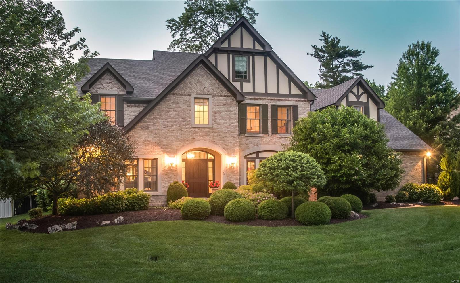 This STUNNING home with immaculate grounds and custom gunite saltwater pool, offer many special features. Beautiful entry foyer opens to living room with French doors, opens to 2-story great room with gas stone 2-story mantle FP & vaulted ceiling. Tray ceiling in dining room and barrel-vaulted hall and butler’s pantry. Gourmet Kitchen opens to Heath room with Vaulted ceilings, fireplace. Split staircase 2nd floor with guest suite with private bath, two bedrooms joined by Jack-n-jill bath, and primary suite, vaulted, private bath with double vanity, glass wall shower & private water closet, two large walk-in closets. 2nd floor laundry room. Private yard with level lot and secluded pool, outdoor kitchen with professional landscaping highlights the almost ½ acre lot. Lower level with, workout room, rec room with wet bar, 5th bedroom with egress, full bath. 3-car oversized garage zoned HVAC, Sprinkler system, fenced yard. Easy Access to airport, shopping, dining and parks. Ladue Schools.