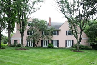 Terrific new price!!!!! An opportunity presents itself!  This pink Ladue landmark is beautifully situated on an acre off South Price and under a lush canopy of mature trees.  This two-family dwelling combines sophisticated style with significant rental income opportunity.  This property incorporates the charm of an English country cottage (smaller, lease property with 3 beds and 3 1/2 baths) with an open, contemporary main dwelling interior including a first floor master, floor-to-ceiling windows and doors with 2 additional bedrooms and 2 full baths upstairs and a beautiful private courtyard with inviting terrace and pool.  Additional features include two over-sized and attached garage spaces for each dwelling.