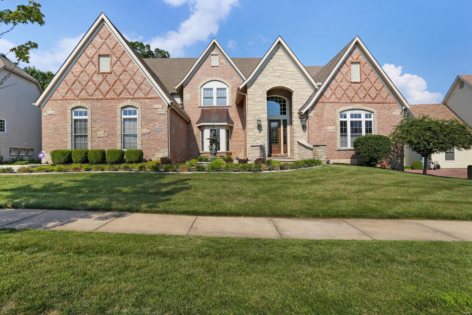 Magnificent custom built Fischer & Frichtel home loaded with upgrades!! Backs to pond and Whapelhorse park. Extensive custom brick work, hardy board siding, paver courtyard, walkway and drive, lovely Bronze fountain in courtyard . Stunning marble entry foyer. Chefs kitchen W/eight burner Viking stove, subzero refrigerator, warming drawer, pot filler three ovens, Butler’ pantry stacked stone fireplace in a hearth room with hidden TV behind the artwork.  Lingerie sink and dog wash in main floor laundry, monitored security system, Kohler artist pedestal sink and toilet with Lennox chandelier and main floor powder bath, All bedrooms have private bathrooms, arched doorways, 8 foot garage doors, wet bar with icemaker and wine refrigerator, Honeywell air cleaner, /Humidifier, 5 inch butterfly casting throughout the main level, Briggs & Stratton whole house generator, the list goes on and on please see attached documents for a full list of upgrades. This outstanding home will not disappoint!! Additional Rooms: Sun Room
