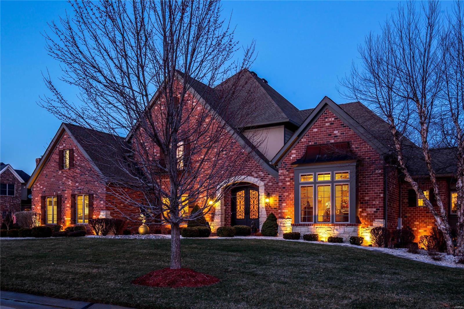 Spectacular 1.5-sty Estate home in prestigious Windcastle! Extraordinary forged iron double doors lead to 2-sty foyer highlighted by dramatic flared staircase, private study with artisan-crafted gates, formal dining room & stunning great room with wet bar & marble fireplace flanked by built-in display cases. Designer kitchen with stacked maple cabinetry, granite countertops & KitchenAid appliances adjoins sunlit breakfast room & hearth room with floor-to-ceiling stone fireplace. Coffered master bedroom suite features domed dressing area with walk-in closets & luxury bath with shower spa & Jacuzzi. Front & rear staircases access 3 additional bedrooms, 1 with ensuite bath & 2 with Jack n’ Jill bath, plus loft sitting area. Walk-out Lower Level includes recreation room with wet bar, family room, workout room & full bath with steam shower. French doors open to outdoor living area with lagoon style pool & patio with pergola. Situated on a .75-acre cul-de-sac lot with 2 decks & 3-car garage.