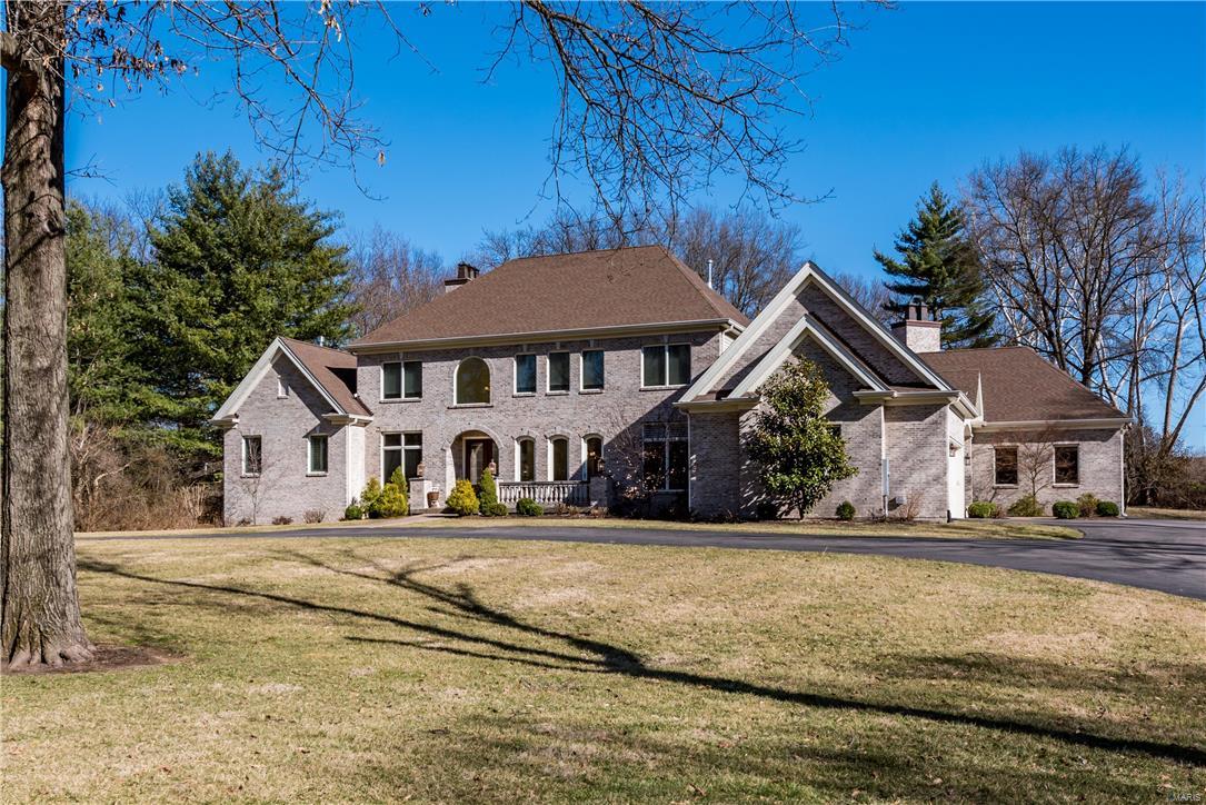 Dreaming of a newer home in Ladue–one that you don’t have to build and is designed for entertaining?  8 year new construction home situated on nearly 3 acres resides in a private location in back of one of Ladue’s most desired neighborhoods.  Over 7,500 sq ft of living space.  Formal areas offer wood paneled Study/Music rm, DNG rm with doors to terrace, a two-story Great rm with FRPLC overlooking the expansive backyard.  Beautifully finished KTCH with SS appliances, center island, breakfast banquet, 2-person desk & refreshment bar.  Hearth rm with gas burning FRPLC and overlooking the outdoor LVNG rm with fireplace and salt-water pool.  Luxurious 1st flr Master Suite with 2 large walk-in closets, soaking tub & separate steam shower.  4 large BDRMS, loft area, laundry area and 3 baths located on 2nd floor.  Over 2,500 sq ft in the lower level including a theater rm, Recreation Room with bar, full bath, exercise room & storage. 2 2-car car garages.  Large Mud room/Laundry Room on 1st flr Additional Rooms: Mud Room