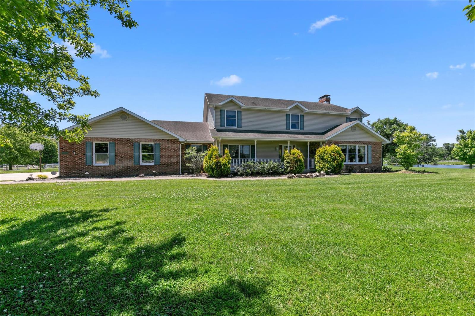 Fully Operational & Established Equestrian Estate located between Waterloo & Columbia IL is now available for purchase! This 35 acre  estate features a total of 15 acres fenced pasture, 75 x 75 Riding Arena w/attached 40 x 60 barn w/stalls , tack room, & wash bay, a 81 x 200 covered arena, an additional barn w/13 stalls, tack room, laundry, kitchen area, & wash bay, 4 car detached garage, & an 81 x 40 open bay out building. With attention to detail & convenience, this property offers Morton Buildings & the finest quality amenities. The serene setting offers a 3 acre lake w/ pavilion to sit & soak in the setting plus a stunning home. The sprawling 2 story home features a generous front porch & beautiful pool area w/ spacious patio surround. Inside, large rooms, tile flooring, & finished basement w/wet bar! Also noteworthy are the 6 acres of woods w/ trails, vinyl fencing w/ electric wire, stereo system in barns, & a fly maintenance system. Seller offering $50,000 repair credit. Additional Rooms: Mud Room
