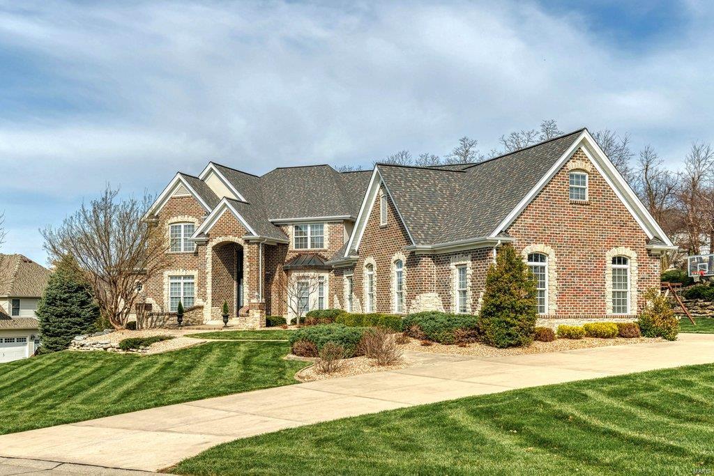 Spectacular 1.5-sty Estate home with over 7000 sf of living space enhanced by superior craftsmanship & distinctive architectural elements throughout. 2-Sty marble foyer leads to private study, elegant dining room framed by arched entryways & stunning great room with dramatic 2-sty bay window & cast stone fireplace flanked by display cases. Designer kitchen with granite countertops, maple cabinetry & premium appliances adjoins breakfast room with bay window & planning center & vaulted hearth room with floor-to-ceiling stone fireplace. The master bedroom suite offers an appealing retreat with 2 walk-in closets, lavish bath with jetted tub & access to patio. The 2nd floor extends the living quarters with 3 additional ensuite bedrooms, family room, bonus room & laundry. Walk-out Lower Level includes recreation room with fireplace & wet bar, game room, 5th bedroom & full bath. Situated on a 1+ ac cul-de-sac lot with pool & patio with firepit surrounded by landscaped gardens & 4-car garage.
