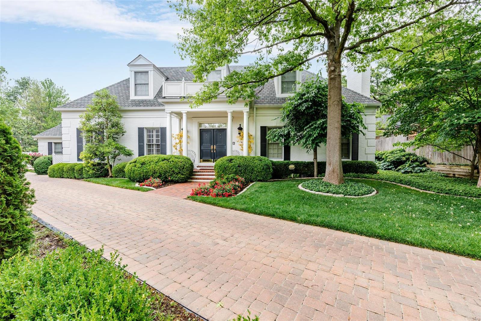 Beautifully finished 5,475 sq ft home. 4 bedroom, 7 bath in Ladue School District. 10 ft ceilings. Large gracious rooms. Exceptional millwork. Hardwood floors. Marble foyer. Lovely eat-in Kitchen with center island, gas range, double ovens, two dishwashers, and oversized pantry. Living Room/Study boasts gas fireplace with marble surround, plantation shutters, and glass French doors to Foyer. Beautiful custom paneled Family Room with views of rear terrace/gardens, gorgeous fireplace, & walk-behind wet bar. Main floor En Suite Master Bedroom has two separate walk-in closets. Master Bath includes dual vanity, BainUltra soaking tub, and marble finishes. 3 additional bedroom suites with full baths. Over 2,000 sq ft finished basement with additional storage rooms, wet bar, rec area, sleeping area, exercise area, & full bath. 3 car heated garage. Private terrace with gazebo. Wonderful home for entertaining. Haverford Terrace is a 10 home community with common landscape maintenance.