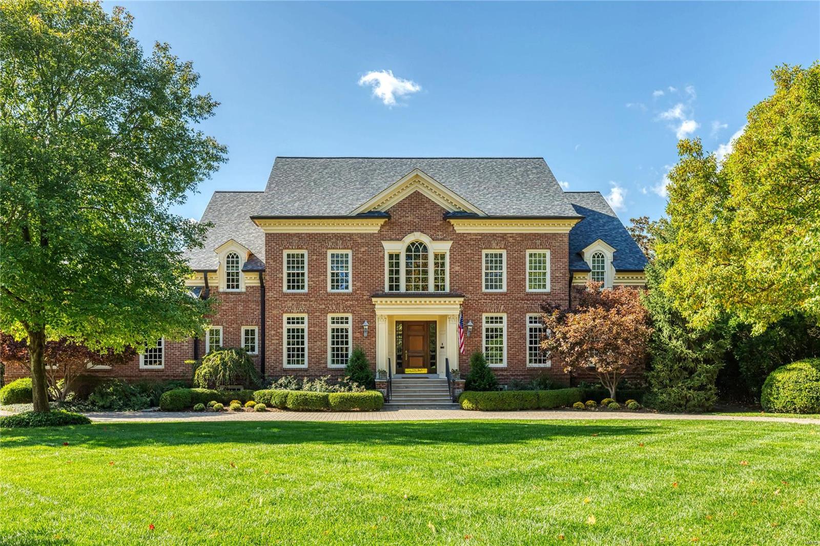 Exquisite 1.5-sty Estate home! Located in one of Ladue’s most desirable & established neighborhoods. Impressive oak foyer with dramatic curved staircase & gallery landing leads to study with custom built-ins, elegant dining room & spectacular great room with architectural columns, marble fireplace & bookcases. Designer kitchen featuring 42” glazed cabinetry, granite countertops & high end appliances adjoins breakfast room with sliding French doors to patio & vaulted hearth room highlighted by floor-to-ceiling stone fireplace. Coffered master bedroom suite combines the enjoyment of a marble fireplace with walk-in closet with laundry & lavish bath with His & Hers shower spas & jetted tub. Front & rear staircases access 4 additional bedrooms, 2 with ensuite baths & 2 with Jack n’ Jill bath. Lower Level includes recreation room with fireplace, 2nd kitchen, workout room, guest suite & ½ bath. Situated on a .87-ac lot with 2 patios, deck, 2 & 3-car garages & carriage house apartment. Additional Rooms: Mud Room