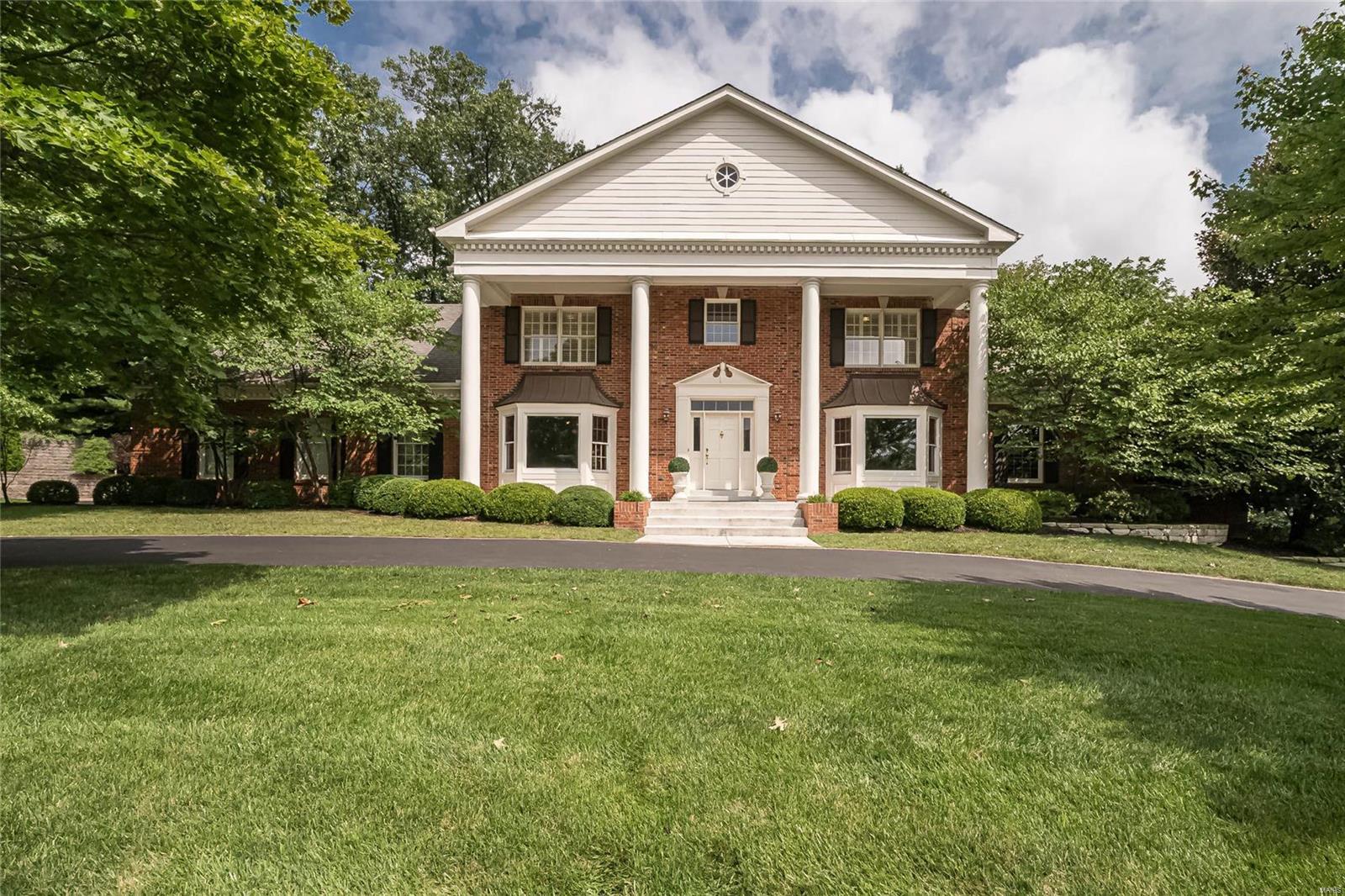 Spectacular Georgian Colonial in prestigious Weston Place! This custom-built 1.5 Sty features extensive millwork, bay windows & oak hardwoods that extend throughout the main living area. Brick-lined front porch highlighted by architectural columns leads to impressive 2-sty foyer, formal living & dining rooms, family room with wet bar & brick fireplace & private study with built-in bookcases. Chef’s kitchen with cherry cabinetry, granite countertops, stainless steel appliances & 7’ center island adjoins convenient office & light-filled breakfast room that opens to screened porch. Spacious master bedroom suite with marble bath with steam shower & jetted tub offers a relaxing retreat. The 2nd floor extends the living quarters with 4 generous-sized additional bedrooms & 2 Jack n’ Jill baths. Lower Level includes recreation room, family room with stone fireplace, gathering bar & full bath. Situated on a 1-ac cul-de-sac lot with landscaped gardens, paver patio with firepit & 3-car garage