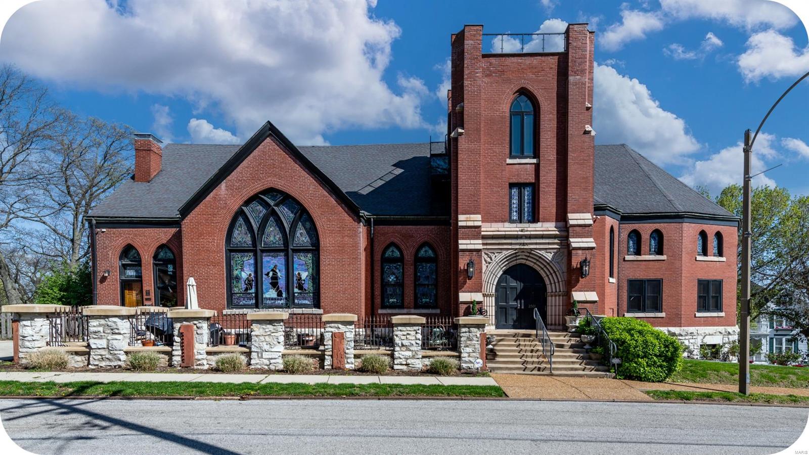 Truly exceptional 120+ yr. old historic gothic church masterfully renovated into a stunning personal residence. This architectural gem boasts exquisite stained glass windows crafted by World's Fair artisans. Step inside & be greeted by a breathtaking sanctuary featuring soaring ceilings, intricate woodwork, exquisite hardwood floors & a dramatic main staircase anchored by a custom kitchen perfect for entertaining. 6 charming bedrooms w/ en-suite luxurious bathrooms & radiant floor heating. Lower level features a large catering kitchen, rec area, 2 baths, bedroom, storage & woodshop. Spectacular bell tower w/ hot tub has treetop views of the city & the Arch. Previously used as an income generating B&B & perfect for a variety of other uses. Surrounded by a lovely patio & gardens. Off-street parking for 6. Located in Clifton Heights, this unique property offers the perfect blend of historic charm & modern luxury. Don't miss your chance to own a piece of history! Suitable for Bed/Brk