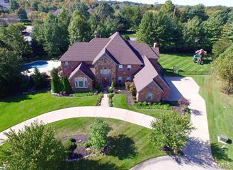 Spectacular 1.5sty on 1 acre, in sought-after Windgate . 6 Bds, 6.5 Bths & 7500+ sqft w/LL. 2sty Foyer, Dining Rm w/elegant chandelier, Vaulted Office/Den & 2sty Great Rm w/wall of windows. Gourmet Kitchen w/custom cabinets, granite counters, butterfly island, Breakfast Bar, 2 SS KitchenAid refrigerators, Dacor ovens & cooktop. Breakfast Rm w/glass doors to patio & Hearth Room w/gas frplc. Coffered Master Bd w/box bay window, His & Her closets & Master Bth w/makeup area, jetted tub, garden window & multi-head shower. Powder Rm & Laundry w/custom built-ins complete 1st Flr. Front/rear stairs to 2nd Flr finds 4 large Bds w/private Bth & walk-in closet. W/O LL w/Family Rm, wetbar, Media Rm, Game Rm, Bd & Bth, Exercise Rm & tons of storage! Highlights: 4 car garage, Creston Sound System & sprinkler system. Relax outside & enjoy private in-ground pool, waterfall & hot tub. Great location ~ close to shops, restaurants & parks. Rockwood Schools! Easy access to hwys.