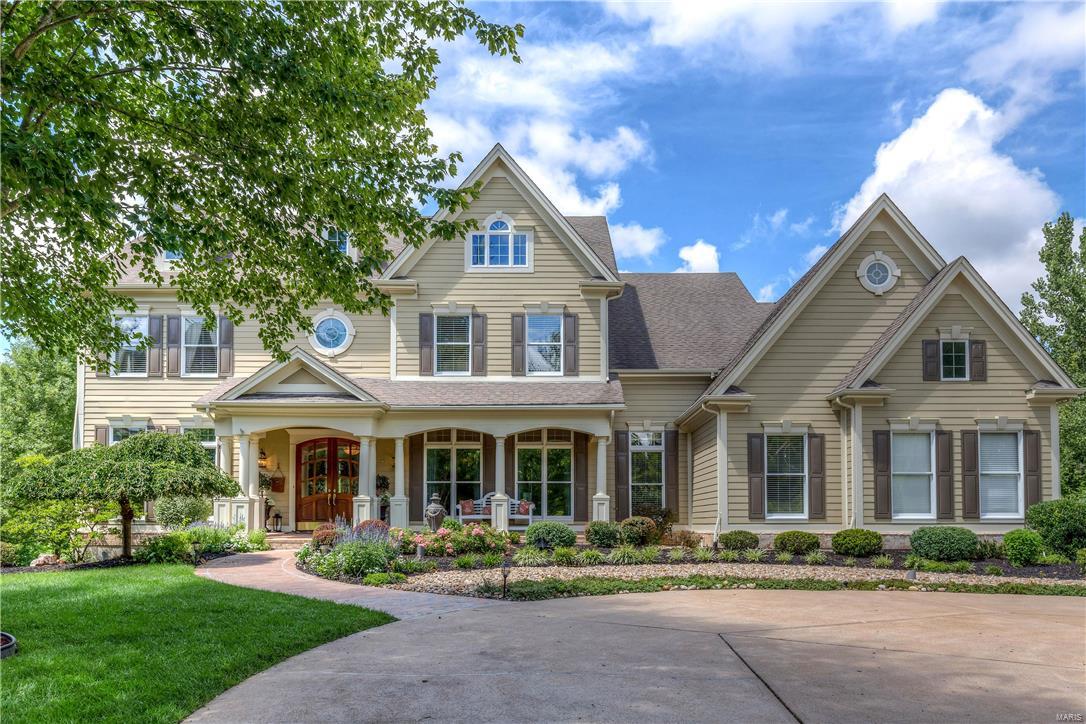 A tree lined entry way leads to this private 1.4 acre home surrounded by woods & beautifully landscaped grounds. Arched walnut & beveled glass doors open into the foyer w/ a dazzling view of a grand staircase w/ built-in display cases, sitting bench, & enormous palladian window that overlooks the pool & grounds. The open main floor has direct access to the pool from the living, kitchen, breakfast, & hearth rms. Perfect for entertaining!  Four fireplaces add warmth to the home. Oak flooring, built-in display cases, crown molding, built-in speakers, & large transom topped windows accent the main level. The kitchen features granite counters, center island breakfast bar w/ Viking 6 burner gas cooktop, Bosch ovens, & Sub-Zero refrigerator. The master bdrm suite has a fireplace, jet tub, separate shower, & 3 vanities.  Lower level includes large FR / rec rm w/ fireplace, possible sleeping room, & full bath. The newer pool features a California Shelf, fireplace, gazebo, & lush landscaping.