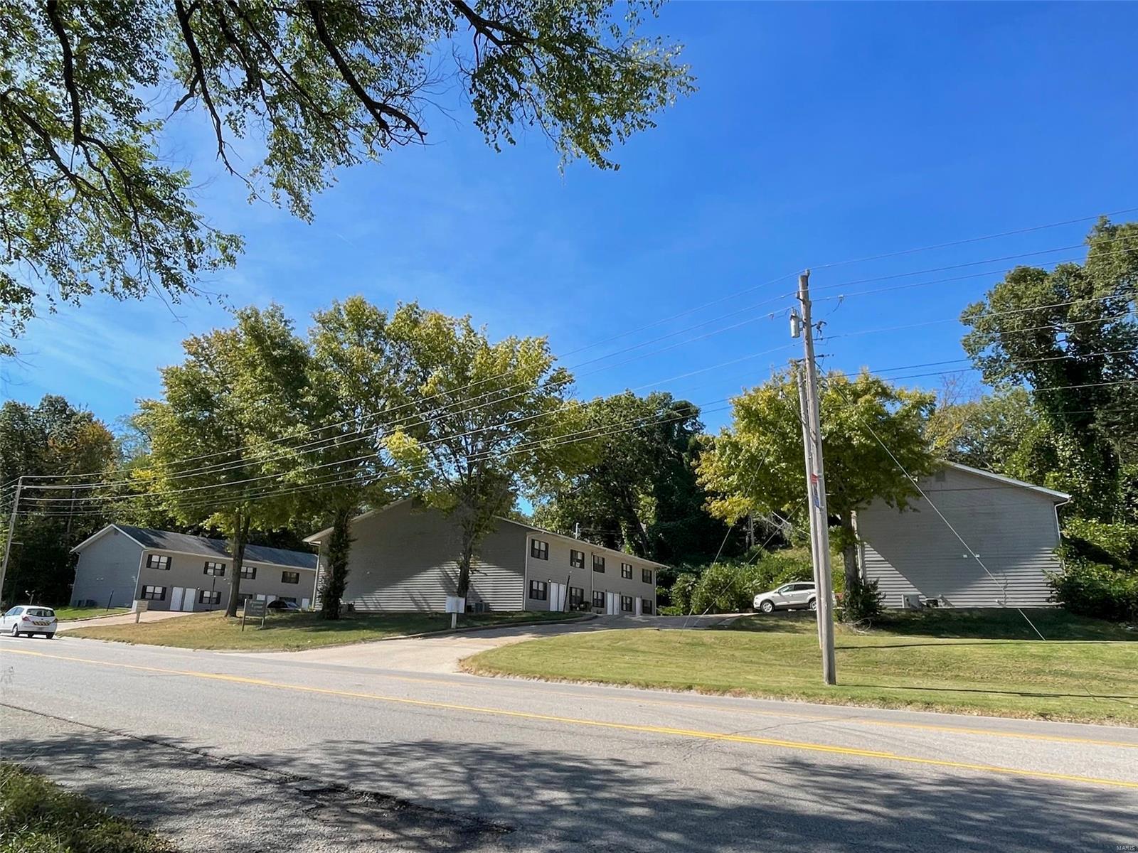 OVER $10,000 PER MONTH IN GROSS RENTS!!! Westside Village is an apartment community located in the heart of Waynesville with quick access to Interstate 44. Featuring 20 units spread over three buildings. All units feature a two story floor plan with two bedrooms and one full bathroom on the upper level, and the kitchen, dining area, laundry room plus a half bathroom on the main level. The living areas are spacious and the apartments have ample room for storage. Units rent from $495 - $595 and there is room to increase rents. 13 units have been partially or fully renovated, 10 new HVAC systems installed and a few new water heaters, with these expenses paid out of the rent. Seller pays for trash service only Call today for additional information!
