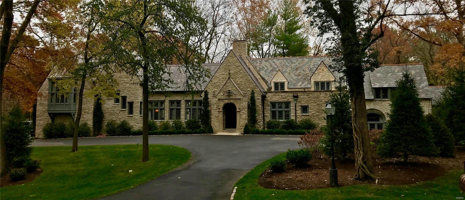 This 7,800 sq. ft. home is totally recreated for today's lifestyle while conserving impressive historic elements - the grand front hall showcases the original stone front exterior with the addition of 24' cathedral ceiling, 61' gallery hall & main staircase. Reclaimed elements mix with sophisticated finishes & high-end appliances: marble, slate, SubZero, Kohler. Stunning living room features a 6'x7' stone fireplace alcove with 5' depth, beamed ceiling, a mix of paneling & plaster finish on the walls, hardwood floors & French doors to sunroom. Marble kitchen with white plaster ceiling & walls opens to the dining room, garden room, family room, 2nd staircase, informal entry & downstairs to the wine room. Luxurious master suite with beamed cathedral ceiling, white marble bath & His & Her closets. 3 additional bedroom suites with marble baths, plus separate bedroom suite 5 with deck located off of the great room. Office. 3-car garage & cubbies. Beautiful gardens, lawn & croquet pitch. Additional Rooms: Sun Room