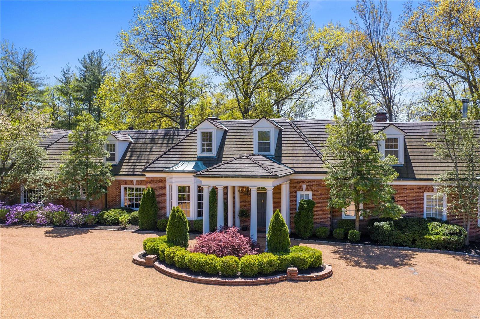 Two-acre estate located in one of Ladue’s premier neighborhoods. As you enter the home, the grand foyer leads your eye to the conservatory room in the back of the house with a soaring 25’ ceiling. This home boasts a stately wood-paneled den with fireplace, gracious living room with fireplace & a formal dining room with a large bay window. The main floor primary bedroom wing features 2 full baths, bright bedroom, wood-paneled study with fireplace & 2 walk-in closets. Roomy kitchen with Wolf, Sub-Zero & Viking appliances, breakfast area & family room. French doors access a magnificent patio & lead you to the beautiful pool & pool house with a bath. Newly finished lower level with bar, wine cellar, rec room, 1/2 bathroom, 4 built-in bunk beds & an expanse of storage. Upstairs are 4 bedrooms, recreation room & 2 full baths. Front-drive is reminiscent of an English-countryside with a stately brick wall that encloses the motor court. 4-car garage. Main floor laundry. 5 brand new HVAC units. Additional Rooms: Wine Cellar
