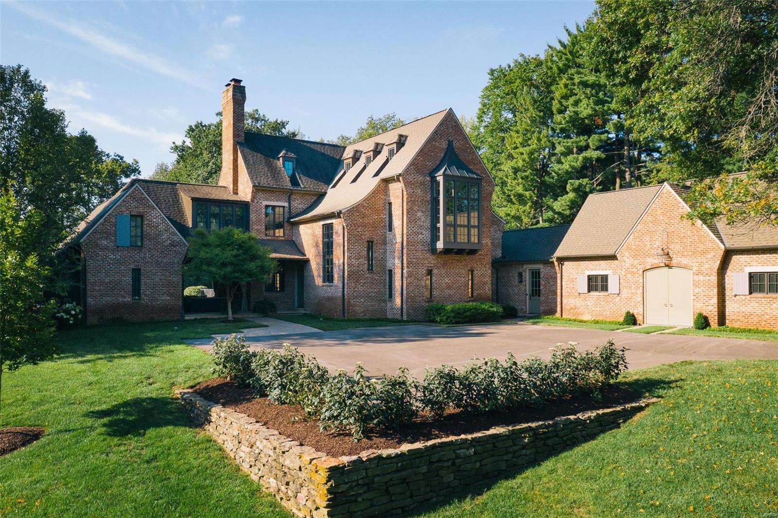 A secluded and peaceful sanctuary on 1.45 private acres in the heart of Frontenac. Exquisite/Timeless/1 of a kind. An architectural masterpiece built in 2007 and situated in tandem to a peaceful abundance of acreage aka The Mercy Retreat. This is more than a custom home, it is a true testament to the McAlpine architectural design philosophy of seamlessly combining the elements of balance, symmetry and style. Creatively designed with 5 bdrms/5 baths in the main house + a 5-star guest house overlooking prime acreage with master suite and mini kitchen equipped to host your special guests in style. Charming covered breezeway with custom millwork and wood-burning fireplace adjoins the main house & guest house, just steps from the 5 star outdoor amenities including pool/pool house, hot tub and sports court. One must see to appreciate the details. Masterfully created with integrity and purpose by renowned Bobby McAlpine who is continually selected as AD Top 100 Architects.
