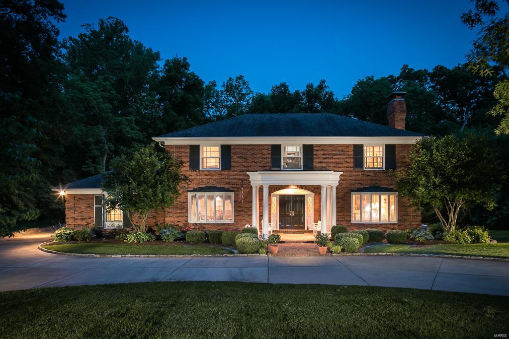 Impressive Executive Home in sought after location. Magnificent two story home welcomes you with spacious entry foyer that opens to a light-filled living room with fireplace. Family room with remarkable wet bar opens to deck and patio overlooking the breathtaking pool backing to woods and perfect for entertaining! Formal dining room, gourmet kitchen with granite counters, built-ins and stainless appliances opens up to a sun lit breakfast room with sky lights.  Five bedrooms include the guest suite on the main level and four additional bedrooms on the upper. The grand master suite with dressing room has oversized his and her walk-in closets and luxury bath. Partially finished walk out lower level with exercise room and family area. Truly a Charmer!! Within walking distance of Old Warson Country Club. Turn your dreams into reality!