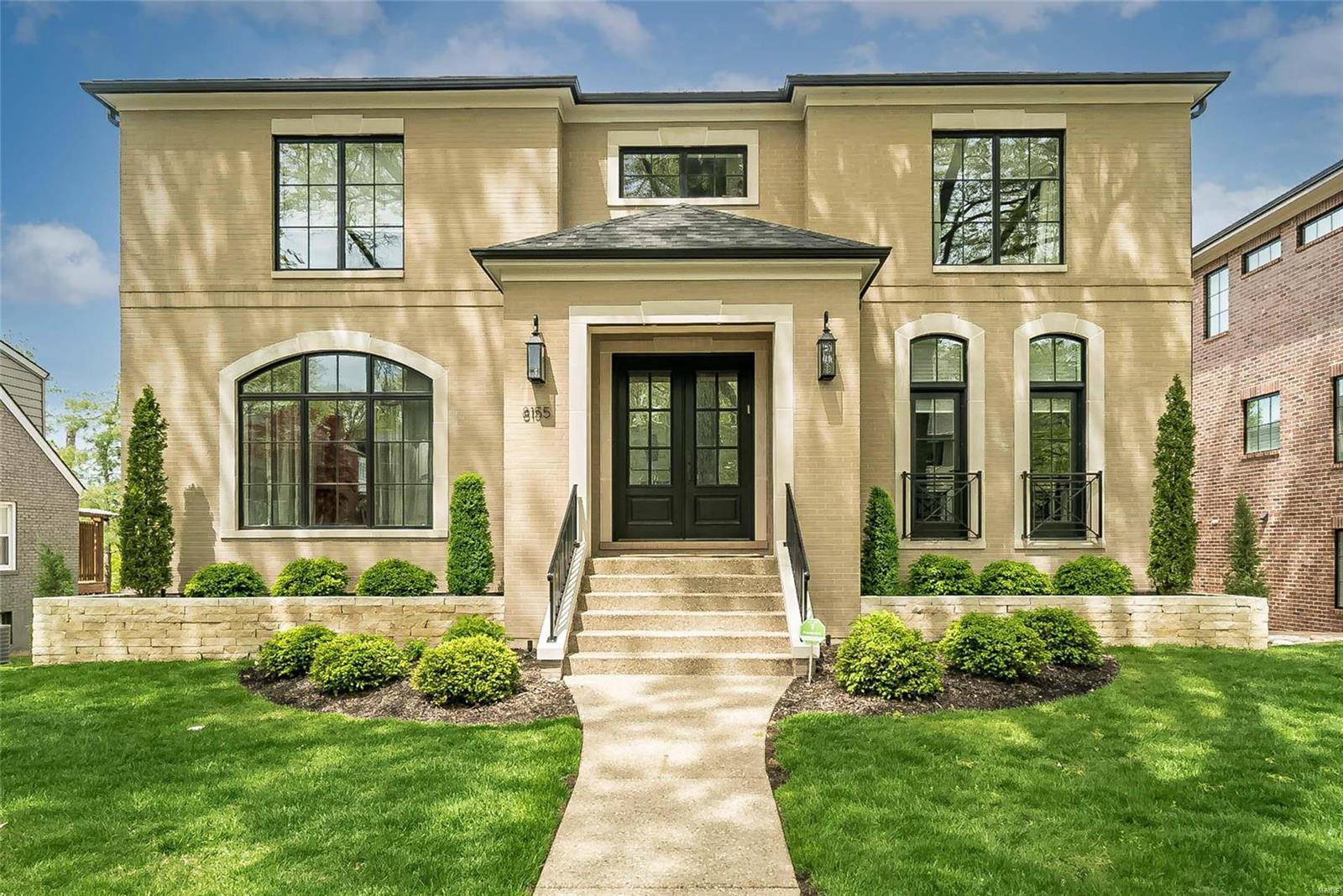 Luxury Clayton buyers, this is the home you have been waiting for. Better than new, this custom-built home sits stately on one of the neighborhoods largest lots (75 feet wide). Limestone & Brick exterior with beautiful contrasting black clad windows. Foyer with chandelier accentuates the 10 foot ceilings leading you past the large dining room & study.  Stunning elevator services all 3 levels.  Gourmet eat-in kitchen with generous island, custom cabinetry & professional Wolf/ Sub-Zero appliances opens to an impressive great room with Box Beam ceiling. 1st floor Master suite features coffered ceiling & large luxurious master bath. Hardwood floors throughout 1st & 2nd levels. 2nd floor features 9 foot ceilings, 3 bedroom suites each with luxury bath & walk in closet, and laundry room. Walk out lower level has open living space with kitchen area, full bath, home gym & storage lockers. Lush, well manicured lawn with oversized deck. Quiet, walkable neighborhood with easy access to Clayton.