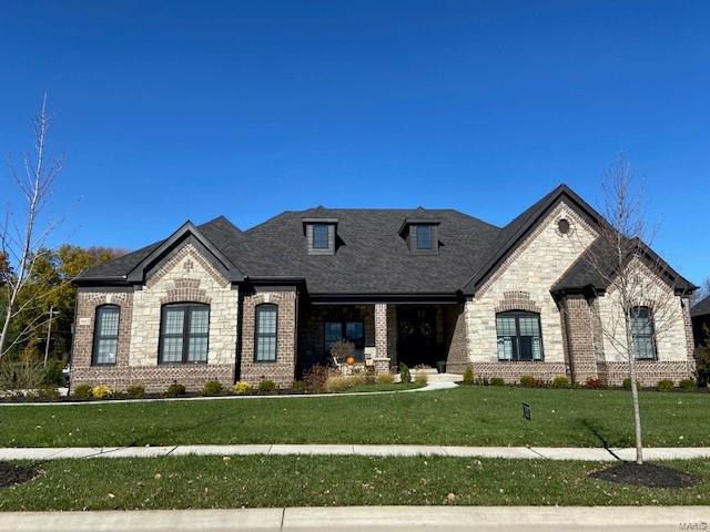 Newest Ranch Home Under Construction "The Kelly".  Purchase Now and make your selections!!! Built by one of St. Louis' premier hands-on builders Claymont Development, LLC-Wesley J. Byrne. A spacious 4br, 3.5ba 1-story w/appx 5600 sq ft of finished living space. 10' First Floor ceilings and an inviting 12' story great room w/gas fireplace and Atrium stairs. Gourmet kitchen w/custom cabs, stainless steel appliances & granite. Master suite w/ 2-pc crown & coffer ceiling, lux bath w/whirlpool tub & separate shower. LL featuring a Media Room & #4 bed & full bath. Four-car side entry garage, 10' LL found., screened-in deck & cedar sun deck, additional patio below. Backs to the lake and common ground. Outdoor hearth area w/ fireplace. Dining & Study have crown and coffer ceilings. Price listed refers to the current base model and does not include any optional features, upgrades, elevations, square footages, or customization. Final calculations may vary once the home is completed.