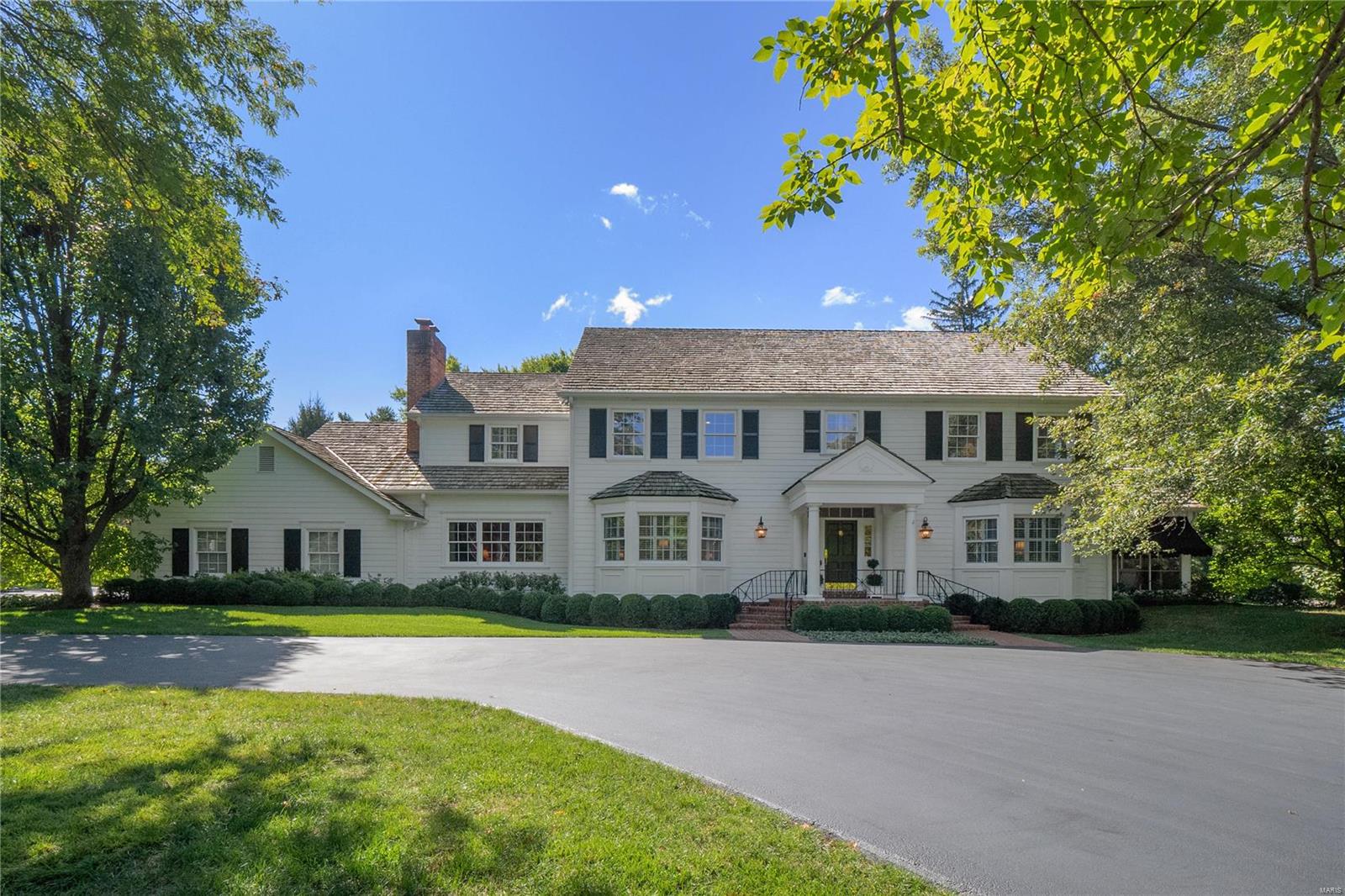 Welcoming and gracious home on private 1+ acre lot in Frontenac. Sun-filled kitchen, eating area, and family room with built-ins and fireplace overlook lush mature landscaping, brick patios, and sparkling pool. Lovely screened porch for enjoying pleasant days. Beautiful dining room with wainscoting and tasteful living room for entertaining in style. Work from home in fabulous wood paneled office with fireplace. Two half baths and large laundry room with second office space including built-in desk complete the first floor. Upstairs the primary suite has cozy sitting area with fireplace and built-ins, two walk-in closets, and luxurious bath. Three additional spacious bedrooms - two share jack & jill bath and third is adjacent to full hall bath. Lower level has multiple rec room spaces, kitchen area, and full bath. Attached charming greenhouse and/or pool house. Abundant storage throughout home. Three car garage, Ladue schools, and convenient location with this exceptional offering! Additional Rooms: Mud Room, Sun Room