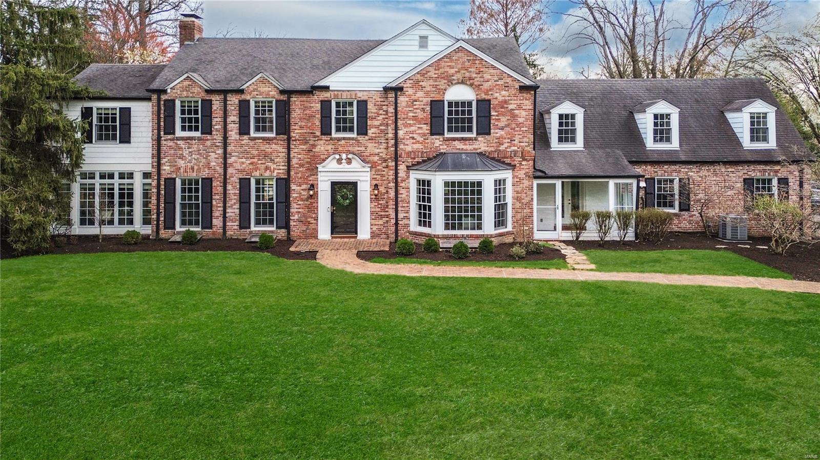 Welcome to this stunning, sophisticated home located on one of STL's premier & sought-after streets. This washed brick home boasts incredible curb appeal & timeless elegance. Step inside & be greeted by a grand foyer featuring an eye-catching staircase that sets the tone! The expansive dining rm & the inviting living rm are perfect for entertaining. The bright kitchen & breakfast rm opens to the main floor family rm, creating an ideal space for everyday living. A charming 4-seasons rm & a cozy den w/ built-ins adds even more character. Upstairs, there is a pleasant primary suite, 3 generous bedrooms, 2 full baths & a loft for the kids make this home ideal for families. The finished LL includes a family rm &  4th full bath for convenience. Step outside into the delightful backyard, where privacy meets luxury. Enjoy the pool, beautiful patio & tennis court, perfect for outdoor entertaining or simply relaxing in your own oasis . This exquisite home offers unparalleled charm & privacy. Additional Rooms: Sun Room