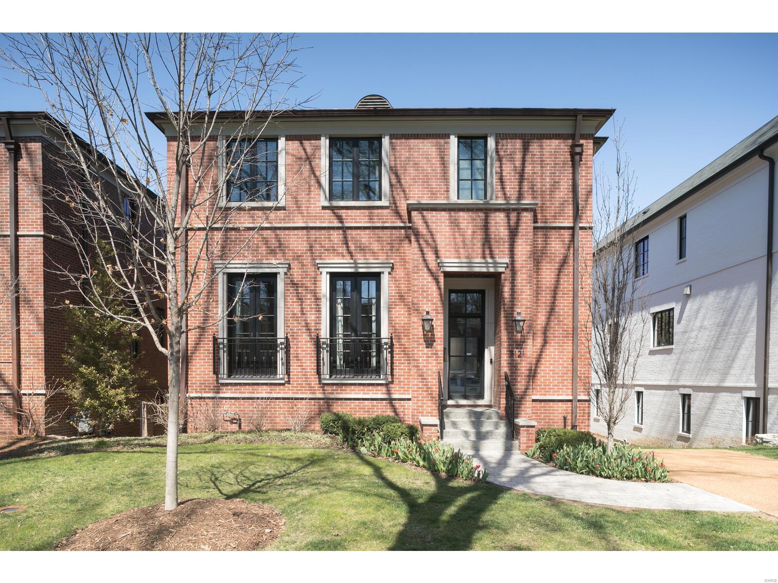 Open Sunday Cancelled!  This 4 year old Clayton Gardens home shows like brand new construction with even more features.  All brick exterior with limestone trim, black architectural windows, copper gas lanterns and custom front door welcome you to the truly stunning interior. This is a WOW home! Light filled 2 story entry, 10 ft. ceilings, top of the line finishes throughout. Gourmet kitchen with Markus cabinetry, hard surface countertops, Wolf/SubZero/Bosch appliances, all open to hearth/great room. Master suite with luxury bath plus 3 additional bedrooms upstairs.  Finished lower level with rec room(wet bar), bedroom and full bath.  Elevator shaft to all 3 floors. Whole house audio/video system, generator, and extensive trim work and molding. Plus, the most sought after location in Clayton; walk to all your favorite restaurants, stores, and parks. This is what you've been waiting for...make your appointments today. Run, don't walk to this one.  Perfection!