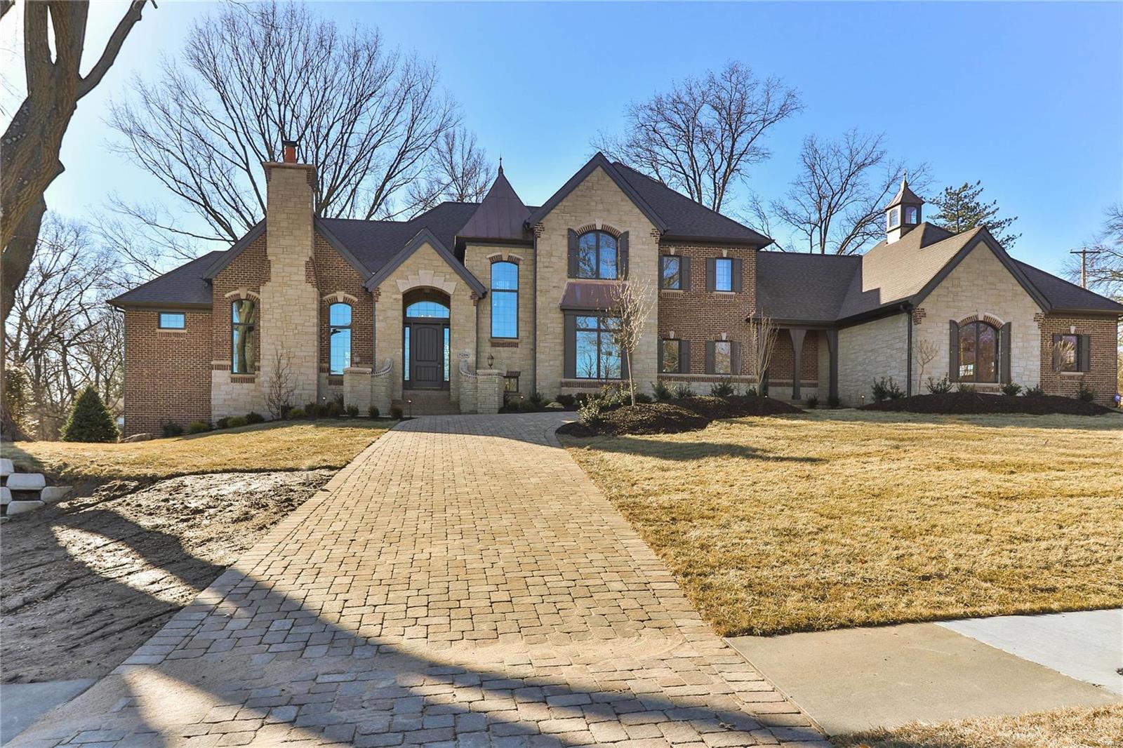 Move In Ready!  Custom Built Luxury Home!  Location, Location, Location!!
A private enclave of 4 one acre homes nestled in the Heart of Creve Coeur!
English/French Tudor Style Stone & Brick w/4 Car Side Entry Garage.  Inviting Interior includes 10'+ Ceilings w/Special Design Features, 7' Two Panel Solid Core Drs, Wooden Window Surrounds, Custom Drywall Arches w/Rounded Corners, Satin Nickel Lever Handles.  Pamper the Chef w/Custom Designer Kitchen, Energy Star Stainless Steel Thermador Appliances including Six Burner Gas Cooktop, Built in Drawer Microwave, Separate Electric Double Wall Ovens, Walk in Pantry w/Solid Shelving.  Oversized Great Room w/Granite Surrounds & Metal Mantle.  The MasterBdrm includes luxury end Suite w/His & Her Adult Height Vanities, Granite Tops & Undermount Sinks, Custom Shower w/Tile Base & Frameless Glass Enclosure.  Lower Level is unfinished but already pre-plumbed for the future and much more!  A Must See!! Additional Rooms: Mud Room