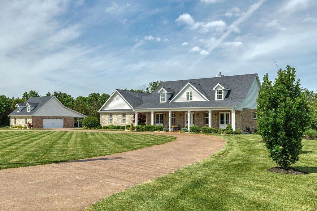 Beautifully designed brick & stone 1.5 Sty on parklike 5-ac grounds. Impressive hardwood foyer leads to elegant dining room & stunning great room with dimensional ceiling, floor-to-ceiling stone fireplace flanked by built-in bookcases & French doors that open to veranda. Spacious open kitchen with Silestone countertops, white Shaker cabinetry, premium stainless steel appliances & 8’ center island adjoins light-filled breakfast room with butler’s pantry & bank of windows. Main floor master bedroom suite with octagonal ceiling & luxury bath with freestanding tub offers an appealing retreat. Oak staircase accesses 2 additional ensuite bedrooms & bonus loft room. Walk-out Lower Level is ideal for casual entertaining with recreation room with gathering bar, office & guest suite. Outdoor living area includes stamped concrete patio with grilling station plus resort style pool surrounded by landscaped gardens. In addition, the property features a 38’ x 30’ garage with carriage house apartment. Additional Rooms: Mud Room