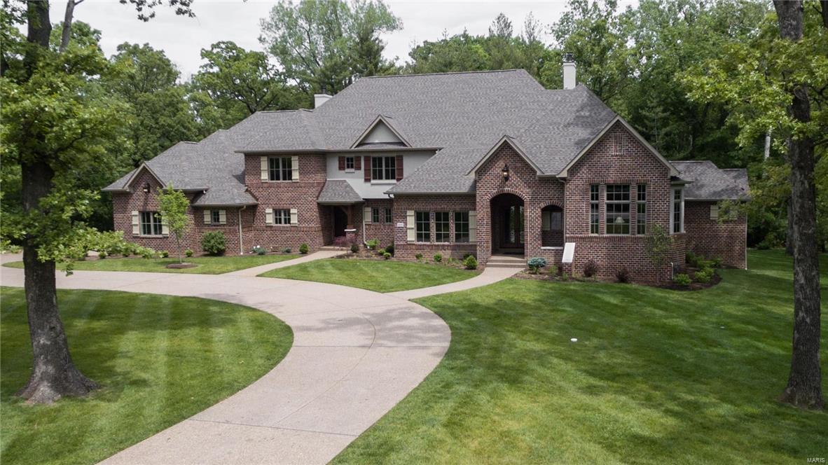 Offered by Kennerly Custom Homes on a gorgeous 1 acre lot. Huge 4 car side entry garage. Aggregate walks & drive. Marvin windows. Solid walnut entry door. 2 fireplaces. Crown & casement moldings through most of the house. 7 1/4” base. 12’ ceiling in great room. Commercial grade appliances. Huge kitchen island with marble tops. Open to Hearth & Breakfast rooms. Butler pantry with bar sink & beverage center plus a 10' walk in pantry. 18x16 Veranda off the Hearth Room. Master bedroom has coffered ceiling with crown. His and hers walk in closet & luxury bath with heated floors. Vaulted ceiling & bay in the den. 4” Hardwood.  Family foyer/mud room with powder room, cubbies, cabinets, & cooks office that's accessed from the garage and the 2nd family entry in front.  Upstairs features a family room, 3 huge bedrooms with private baths & walk in closets, plus a second laundry room. 3 zone HVAC. Full landscaping, sod, & sprinklers. Stereo & alarm. 1217 sq ft of basement finish with bath.