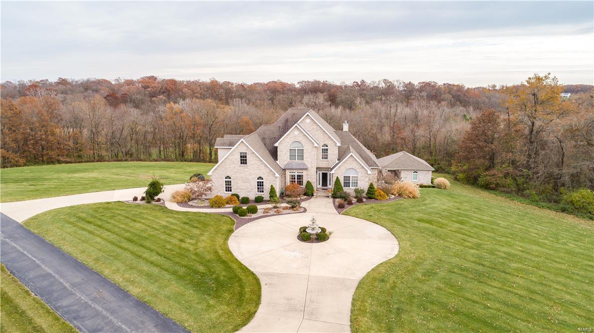 Luxury home on 26 +/- ac. tranquil setting, rolling hills & mature hardwoods. Gated property w/ private tree lined drive. Eat-in kitchen opens to large family room 20’ ceilings & wall of windows overlooking in-ground pool & pool house w/ sauna & 1/2 bath. Main level master suite w/ walk-in closet & custom master bath. Formal dining room, mud room/laundry, private office, exercise room, rec room located on UL & one in LL that includes large wet bar, custom 450 bottle wine cellar & potential for 2-3 additional bedrooms. Backup generator, surround sound in great room, master bedroom & addtl sound system in LL rec room. 24x15 composite deck. Incredible views w/ frequent wildlife activity. Outstanding hunting locations w/ included mini hunting hut & 10 tree stands. Addtl. entertaining area in 30' x 40' pole barn, 10x10 sliding door & man door, cement floor, wet bar, in/out dog kennel, propane heater & wood burning stove, bathroom. 2 addtl storage sheds & so much more! Additional Rooms: Mud Room