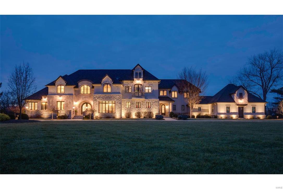 AMAZING NEW PRICE! Stunning & sprawling 4 yr old custom built 1.5 story stone estate! This 13,642 Sq. Ft. manse sits on 4.52 breathtaking acres! Kitchen that a chef would dream of w/exotic granite & opens to a beamed family/hearth room & breakfast room w/computer center.  Main floor master wing w/his & her offices, sitting room, fireplace, spectacular bath w/his & her closets.  Loggia w/ full kitchen, fire place, & views of the outdoor oasis: Pool Tron built oversized pebble tec pool w/ fountains, slide, & misters; play set that can compete w/any real park, & beautifully landscaped grounds...plenty of room for the kids to play & pets to roam.  5 bedrooms, playroom & loft upstairs (including private apartment for nanny or in-laws). Lower level w/movie theater, concession stands, billiard room, amazing bar w/full kitchen, family room, pool bath & changing room. Geothermal, 5+car garage, elevator & exquisite details in every room. Truly stunning home! Some Accessible Features Additional Rooms: Mud Room