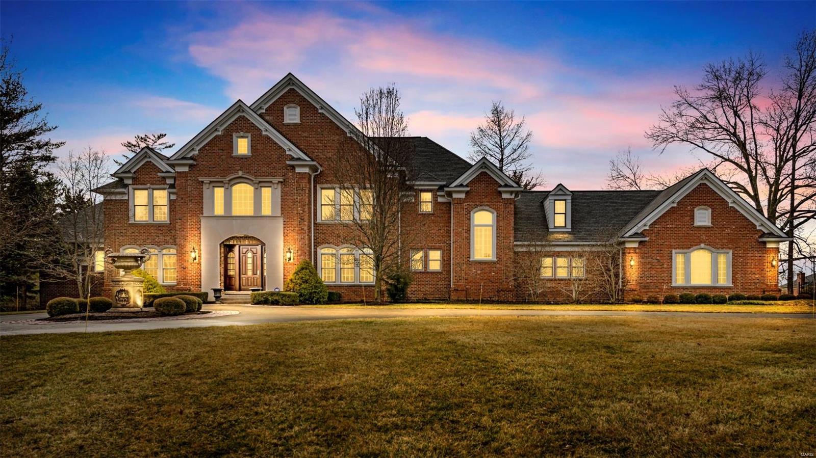 World Class property of exquisite design describes this Mayer, custom-built home. Poised on 3 acers & 10,000+ sf, this home is amplified by soaring ceilings, elaborate millwork & high-end finishes. Striking, 2-story marble entry is flanked by a handsome study & a DR featuring a granite serving buffet. Spectacular GR features a fp, wood floors & bar area. The chef’s style kitchen is highlighted by 2 islands, high-end appliances, rich cabinetry & adjoins a bfast room & hearth with a stone fp. Gorgeous MBS offers a fp & a beautifully appointed bath with heated floors, jet-tub, shower & 2 walk-in closets. Stunning staircase accesses 3 add’l ensuite beds, laundry & a loft area. The LL offers a FR with wet bar & pass-thru fp to a rec room that walks out to the in-ground pool. A media room, gym, bath with steam shower, studio and 5th bedroom complete the LL. Professional landscaping with extensive landscape lighting, multiple patios, 4-car garage, & so much more. One of St Louis' finest!