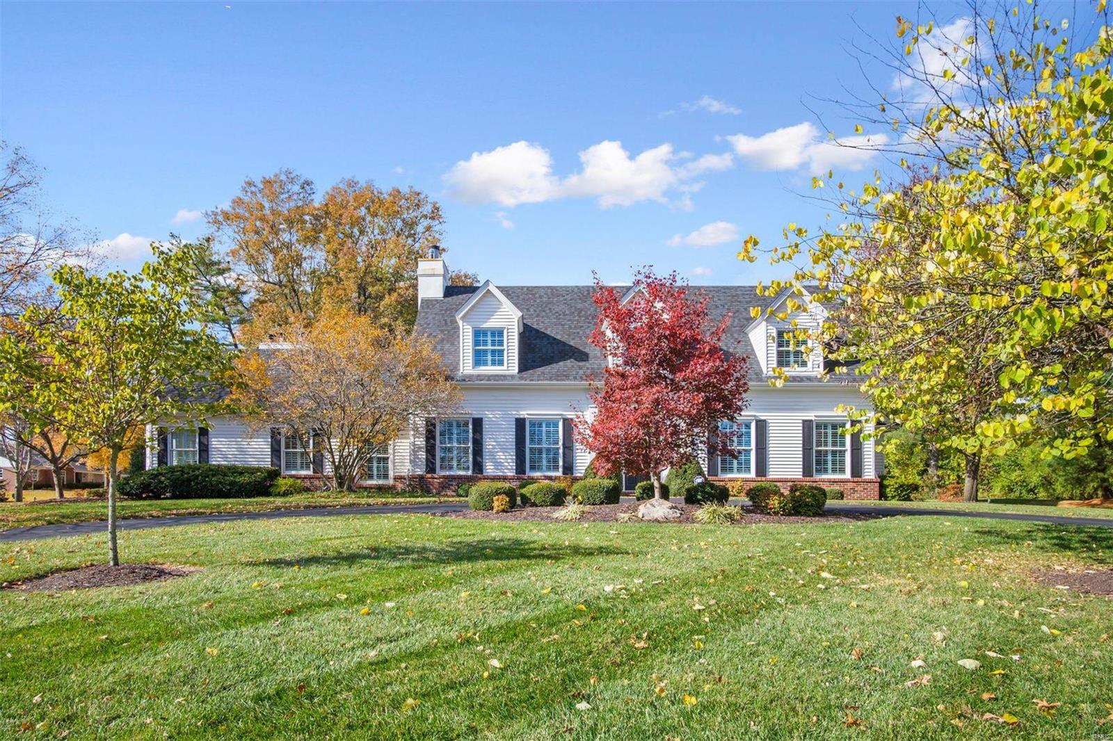 Quintessential white Cape Cod on gorgeous acre lot in Frontenac is now available! This lovely home has an open & airy feeling throughout with lots of light pouring in the beautiful oversized windows. The floor-plan is great with flexible rooms that can be used for dining, working, or entertaining. Wood floors and nice millwork throughout give this home a cozy custom feeling. The back of the house has a lovely wall of French doors leading to large brick patio & private acre lot. Vaulted white kitchen is open and bright with adjacent  “party” bar which is great for parties or homework! Main floor Primary Suite has spa bathroom & large custom walk-in closet. First floor is complete with office, main floor laundry, & large pantry/mudroom. Upstairs you will find 3 large bedrooms & 2 full baths. Recently finished LL has great space for entertaining with large family room plus 2 more rooms for hobbies/toys/office. New paint 2020, Roof 2018, 2 HVAC systems 2017, Ladue Schools, 3 car garage. Additional Rooms: Mud Room