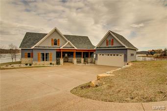 Captivating view and great access with gentle slope to the water’s edge! This home offers one of the best views Alpine Lake has to offer. With spectacular lake views from every room of the house, this setting is sure to please! The property features a private dock area as well as patio at the water’s edge for lakeside entertaining. Built in 2015, the condition of this home looks and feels untouched. With an eastern exposure, enjoy the sunrise every morning and the shaded patio during the heat of the day. This home is ideal for use as a primary residence or that secondary getaway with little maintenance and upkeep to the exterior, providing more time for relaxation and recreation. The open floor plan creates plenty of space for family and friends to gather with double French doors leading to the prominent view from both the open patio as well as a covered patio just off the master suite. Come see all this property has to offer!