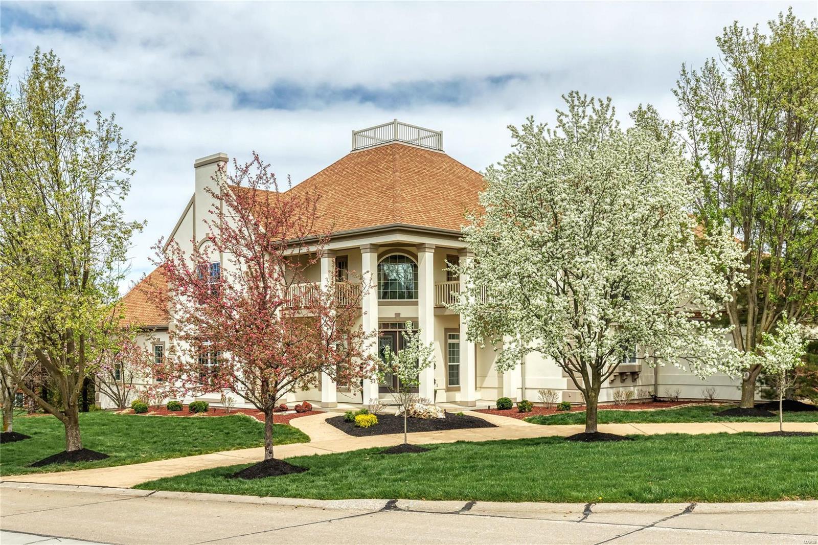 This stunning Schaeffer constructed contemporary features sophisticated interior detailing & appointments throughout including oak hardwoods, 10’ ceilings & expansive windows. Impressive entry foyer leads to private study, dining room framed by arched entryways & striking 2-sty great room with granite fireplace, dramatic wall of windows & 3 sets of double atrium doors that open to deck. Designer kitchen featuring 42” white cabinetry, granite countertops, premium appliances & 8’ center island adjoins light-filled gathering room. Primary bedroom suite with fireplace & luxury bath with fireplace & shower spa plus a 2nd bedroom & hall full bath complete the main floor living quarters. Oak staircase accesses 3 additional bedrooms, 1 with ensuite bath, bonus loft room & hall full bath. Walk-out Lower Level includes recreation room with 3rd fireplace, game room, media room, gathering bar, workout room & full bath. Situated on a .8-ac lot with deck, covered patio, firepit, hot tub & pool.