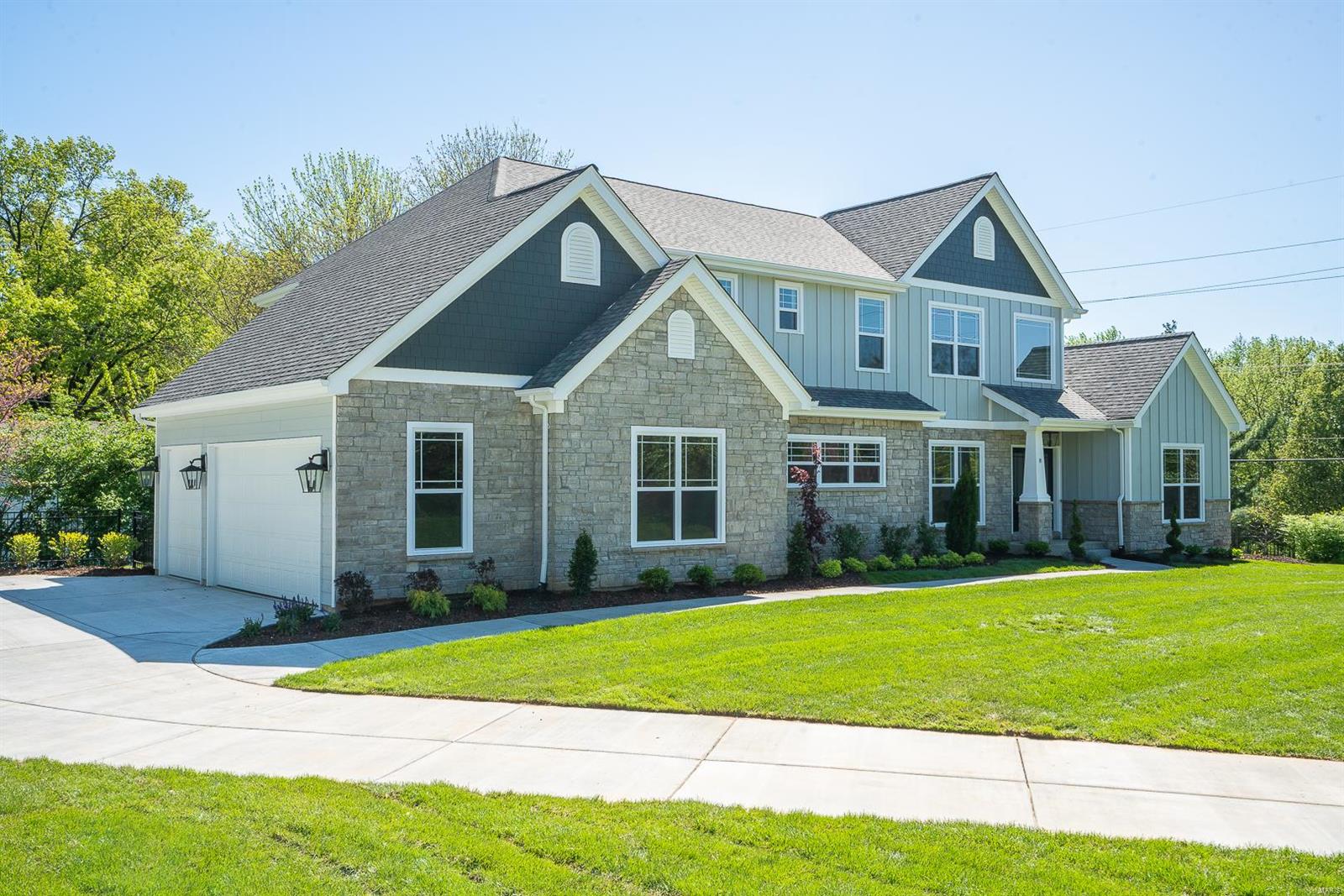 This fabulous/modern 1.5 story home, located just a few blocks from MICDS, was just completed by NJL Custom Homes, known for their cutting-edge designs. This wonderfully open floor plan features a very hip/modern state of the art kitchen with massive center island & stunning custom cabinetry. It overlooks the breakfast/hearth room where you can enjoy your morning coffee by the warmth of one of two fireplaces. The centerpiece of the main level is the light-filled great room with 12-foot box beam ceilings. It's stately, without being stuffy, so it's a room you'll use every day. There are also BOTH upper and lower level family rooms, as well as main and 2nd-floor laundry rooms! A private master suite completes the main level and upstairs are 3 additional bedrooms as well as a 5th in the finished lower level. The exterior includes a 3 car side entry garage, sprinkler system, Hardie cement siding, aluminum fencing and two rear patios perfectly situated to take in the views of the yard.