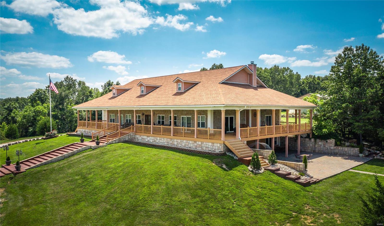 Located just a couple of hrs from StL, MO & bordered on 2 sides by Mark Twain Forest, allowing for 1000’s of acres for add'l hunting, horseback riding or utving.  This gated retreat has perimeter fencing throughout & 50/50 mix of woods & prime pasture land 
that deer, turkey & a resident Mountain lion call home.  Abundant w/water, & 6 live springs, Barney Creek running through & a 2.5 acre stocked lake w/fountain that the 7600 sq ft lodge w/wrap around deck overlooks.  No luxury was missed on this custom build w/5 bds, 3.5 ba, radiant heat flooring, intercom system, master bath steam shower and a custom kitchen to mention a few.  This property also includes a 40x60 insulated metal barn w/concrete flooring 220 electric, 13 foot oversized garage doors, water & RV shed. A 30x50 poly-carbonate greenhouse, small orchard, chicken coop, a private caretaker residence & own helicopter pad. Property can be subdivided. Please call agent for more information.