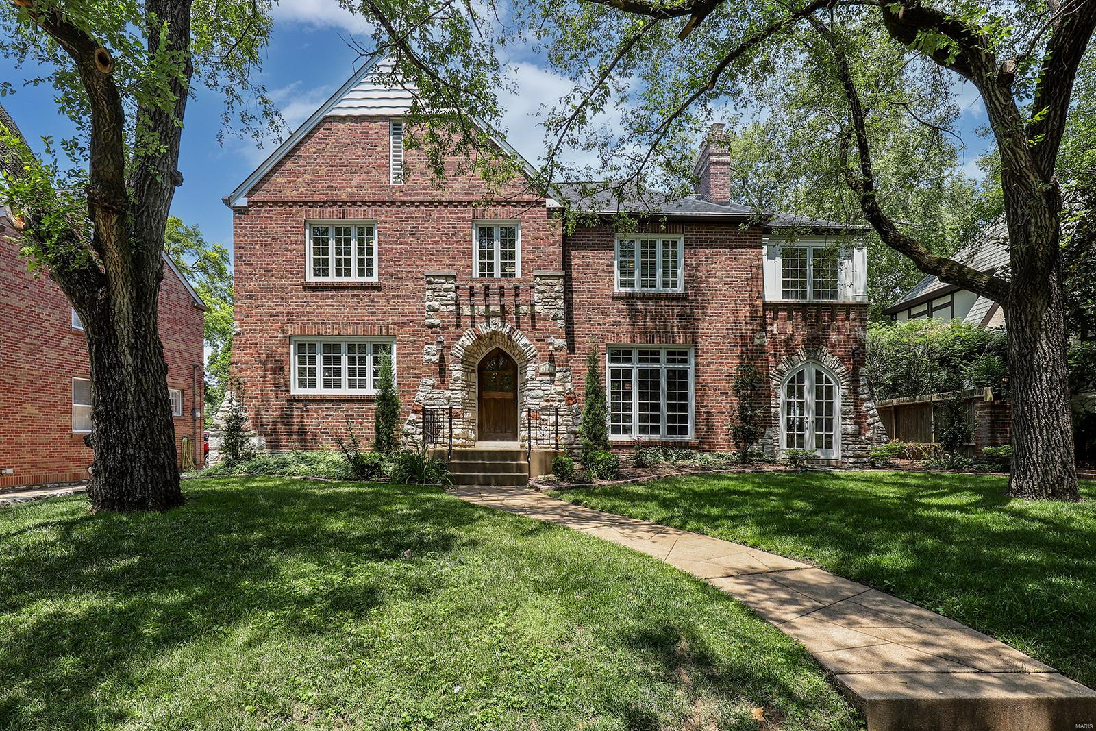 Charming 2-Story English Tudor home nestled on plush landscaped lot in the desirable Davis Place neighborhood – Top Rated Clayton Schools. From the minute you drive up to this house, you will see pride and ownership. This 3 Bedroom, 3.5 Bath home boasts a bright and open floorplan, has significant updates, made by its current owner, and 3,716 square feet of living space, including the awesome finished Lower Level. When you walk through the handcrafted front door, into the Entry Foyer, you will know you are home. Highlights: newer roof and gutter guards (2022), newer sewer lateral (2022), newer driveway (2021), newer roof insulation (2021), a tremendous amount of newer Pella windows (2020), 2-car detached garage, and as a bonus - a charming playhouse with newer roof (2022) ceiling fan, built-in bookcases, tongue and groove paneling, laminate flooring and shake roof which could be used as a studio or potting shed. Relax outside on the rear deck, and enjoy your charming, level backyard! Additional Rooms: Sun Room
