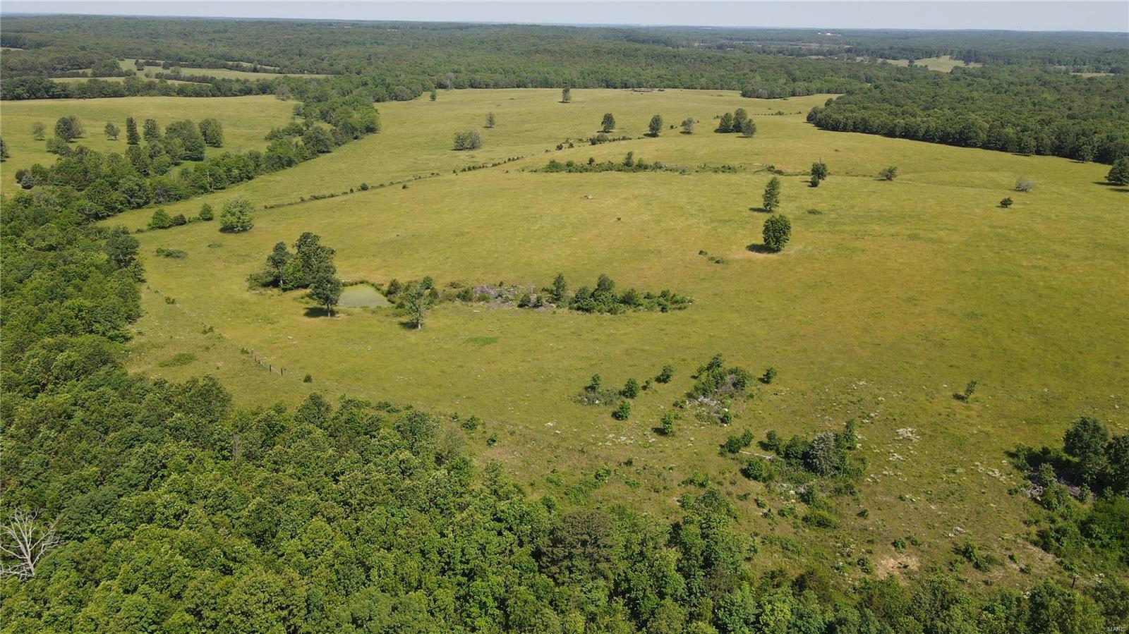 VIP 4629 Check out this 364.9 acre farming paradise! This pasture ground will handle 90+ head of cattle. The farm is in a lime, clover seed and fertilizer program. Lime was applied in 2022 on 100 acres. Program can be transferred to new owners! The property offers some cross fencing, perimeter fencing, 7 ponds, 2 wells, cattle waterers, large working pen with feed lot potential, a creek, a nice food plot, and some excellent hunting!! There is some marketable timber but mainly all pasture. This slab home is a 2 bed 1 bath with an eat-in kitchen and utility room. 16x26 attached garage & a nice concrete pad and 18x32 stick frame carport. The Farm has a multiple bay 16x95 utility shed, a 40x33 barn on a concrete foundation, and a 40x60 pole barn . There are many possibilities with this property with multiple build sights. This farm is pretty well wide open and has some amazing views! Close to Montauk State Park and the Current River!! Don't miss out on this large piece of land!!