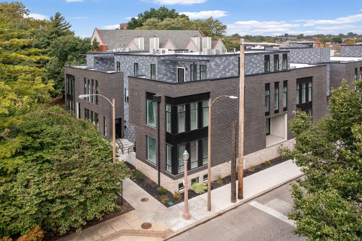 Stunning new construction townhome with MULTIPLE OUTDOOR SPACES! This 3-story, corner residence has a custom brick façade housing light filled spaces loaded with designer finishes. Step inside to tall ceilings, wide plank floors & an open living/dining area with large picture windows. The kitchen is fabulous with Bertazzoni appliances, oversized island, quartz countertops and a private terrace. Upstairs find two bedrooms & full bath, laundry room and 2nd terrace. The 3rd floor is home to a luxurious primary suite with walk-in closet & bath with double sinks, custom tile, oversized glass shower with dual heads/frameless door, a 3rd terrace and a wet bar leading out to a PRIVATE ROOFTOP TERRACE. A fourth bedroom & full bath in the finished lower level & 2-car tuck under garage provide plenty of space for everyday life and the upgraded PRIVATE ELEVATOR makes it easy to get there. Perfectly situated on the corner of N Sarah & West Pine, facing the manicured cul-de-sac, in the walkable CWE!
