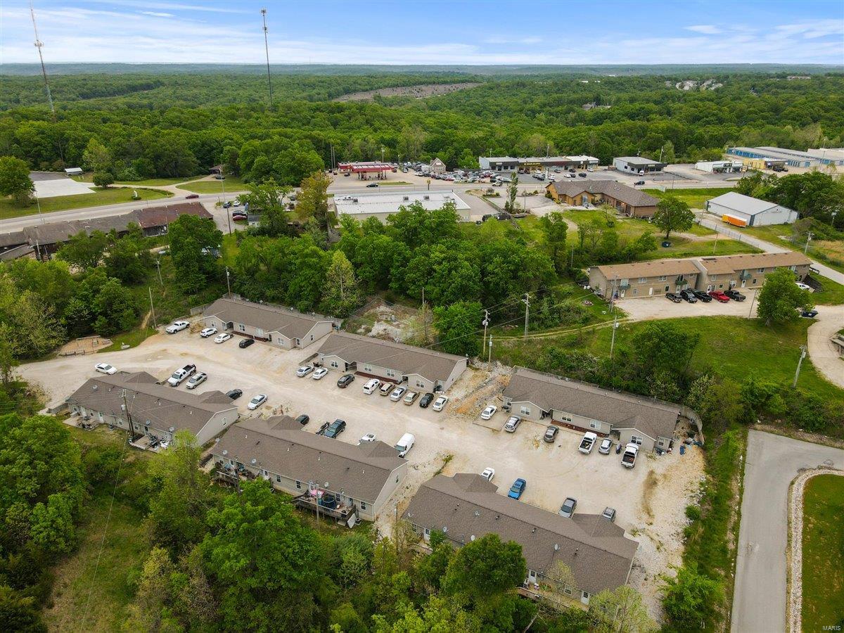 Fantastic 24 unit apartment complex in Camdenton! Newer construction built in 2011 and all city utilities. Property consists of 6 buildings with 4 units per building. Each building has two 3 bedroom 2 bathroom units and two 2 bedroom 1 bathroom units. All units have in unit washer and dryer. Property has 100% occupancy and vacancies always rent immediately with little to no advertising by word of mouth! Tenants pay city water and sewer. Market rents are $900 for the 3 bedroom and $750 for the 2 bedroom. Great investment opportunity for an incredibly low maintenance property. Come see this one today before its too late!