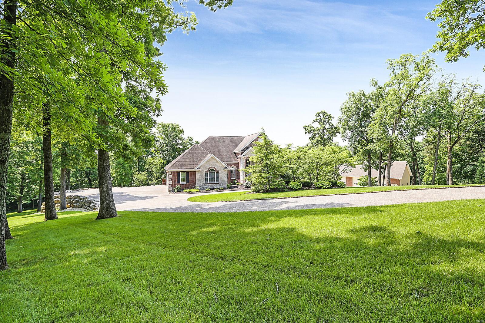This beautiful 1 1/2 story home is situated on 9.68 ac that backs to a SERENE park-like setting. REMARKABLE DETACHED 2800 sq. ft. 3 BAY OUTBUILDING w/sm kitchenette, 1/2 ba, 200 amp service & HVAC, great for your storage, workshop or entertaining. Come enter to find a MARVELOUS 2 story entry, flanked by a formal dining room. Great room boast w/gas stone accent fireplace. GOURMET kitchen w/custom cabinets, center island w/granite countertop, walk-in pantry, planning desk & SPACIOUS breakfast room that leads to a large deck. Main floor master suite w/sitting room, walk-in glass block shower & separate jetted tub, dual sinks w/toe heating floors & private deck w/hot tub. Some GORGEOUS Tiger Wood floors. Mud room/large laundry room. Upper level offers 2 bedrooms each have private bath. W/O lower level offers a nice family/rec area, custom bar w/kitchenette area, office/other, full bath & storage. 3 car attached garage. MAGNIFICENT curb appeal, aggregate circle drive & patio. So much more. Additional Rooms: Mud Room