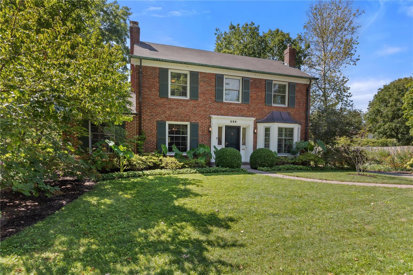 Welcome to 509 South Central Ave in the heart of the sought-after Davis Place neighborhood, Clayton! This charming and updated home, has been LOVED by its owners for 38 years! Main Floor offers a bright and vaulted office with serene backyard views. Elegant LR with FP. Gourmet eat-in kitchen w/center island, custom built-in bar & desk and stainless appliances. Spacious GREAT ROOM off the kitchen w/ bay window & built-in bench seat. You will love the outdoor oasis w/walk-out deck, patio, & lush gardens. 2 car attached garage w/rear entry leading into a convenient landing area. 2nd Fl boasts 4 spacious brms, 3 full ba, including a luxurious primary suite w/ 2 custom closets & spa-like ba featuring double sinks, walk-in shower, water closet. Bonus landing office nook, perfect for work or study. Enjoy the LL rec rm complete w/ half ba, laundry, & office. Award winning Meramec Elem is your neighbor, and just a stone’s throw from downtown Clayton. Move right in, you'll never want to leave!