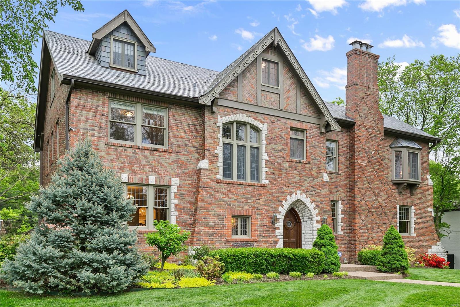 ABSOLUTELY BEAUTIFUL 5353+sq.ft. Ladue home w/ many original, fine architectural details combined w/ EXTENSIVE 2014 UPDATES THRUOUT! Enjoy the conveniences & beauty of the TOTALLY RENOVATED KITCHEN & ALL 4 FULL BATHS. Even the SALT WATER POOL was built in 2014! Truly MOVE-IN CONDITION! Lovely refinished hardwood floors thruout. Kitchen was DESIGNED BY EDWIN PEPPER w/extensive custom cabinetry, stunning marble countertops, stainless applncs, & beautiful chandeliers. Master bath was also totally renovated in 2014. Master bdrm has His & Her's separate closets: Her's is a newer, large walk-in closet w/custom built-ins. 5 other spacious bdrms (3 on 2nd flr & 2 on 3rd flr) share 3 full baths. One bedrm w/ensuite bath. All renovated in 2014 as well. There is even a great Rec Rm in the LL for family & friends to enjoy. Convenient 2nd flr laundry too! 3-car garage. New roof in 2014. Fabulous subdivision! This home is PERFECT FOR INDOOR/OUTDOOR ENTERTAINING & will certainly have everyone in awe! Additional Rooms: Mud Room, Sun Room