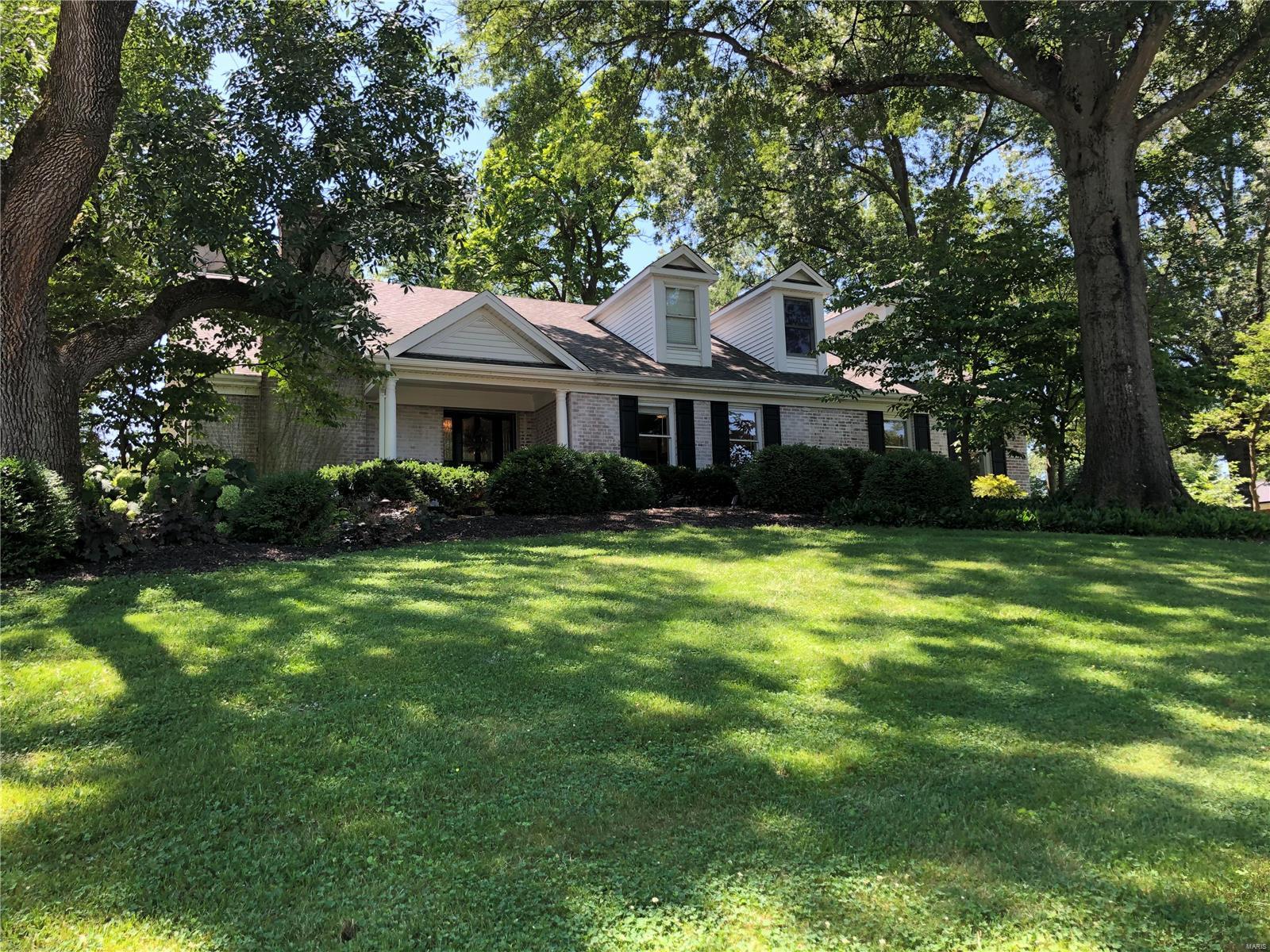 IRRESISTIBLE OPPORTUNITY! This property will surprise and delight. The charming home is nestled on a one-acre lot, and every inch of has been updated for today's lifestyle. The foyer leads to stunning living and dining rooms with hardwood floors and chic finishes. The gorgeous, updated kitchen will delight, with a sunny breakfast room and convenient laundry nearby. The great room features a stone fireplace, vaulted ceiling and stunning views of the patio and backyard. The main floor master suite is a true oasis, with a walk-in closet space that can only be described as opulent, with a spectacular bath adjoining. Two other bedrooms on the main floor share an updated jack-n-jill bath, with 3 additional light-filled bedrooms and a loft playroom (complete with tunnel) upstairs. The lower level rec room includes galley kitchen, exercise room, bonus room and hobby room. Three car garage and an ideal location close to hospitals & schools make this listing irresistible.