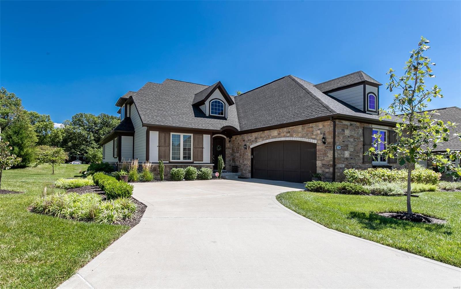 Sitting on arguably the best lot in the neighborhood, this stunning 5 yr old home offers the perfect combination of carefree condo-style living & single family privacy. Main floor master suite has a coffered ceiling, walk-in closet, large bath w/double vanity & custom shower. Additionally, the first floor boasts a guest room w/private bath, great room w/box-beam ceiling & stacked stone fireplace, large, open kitchen w/custom cabinets, butlers pantry, huge walk-in pantry & breakfast area which overlooks park-like grounds & private patio, private office, laundry room, dining room, powder room & mudroom.  Large bedroom w/private bath & family room complete the second level. Finished LL is perfect for entertaining - wet bar, pool table area & room to relax, play, workout. Plus another bedroom, full bath & tons of storage. 2-car garage w/new single oversized door allows easier access to park large SUVs. Move-in ready and perfectly decorated. Please note upgrades listed on features list. Additional Rooms: Mud Room