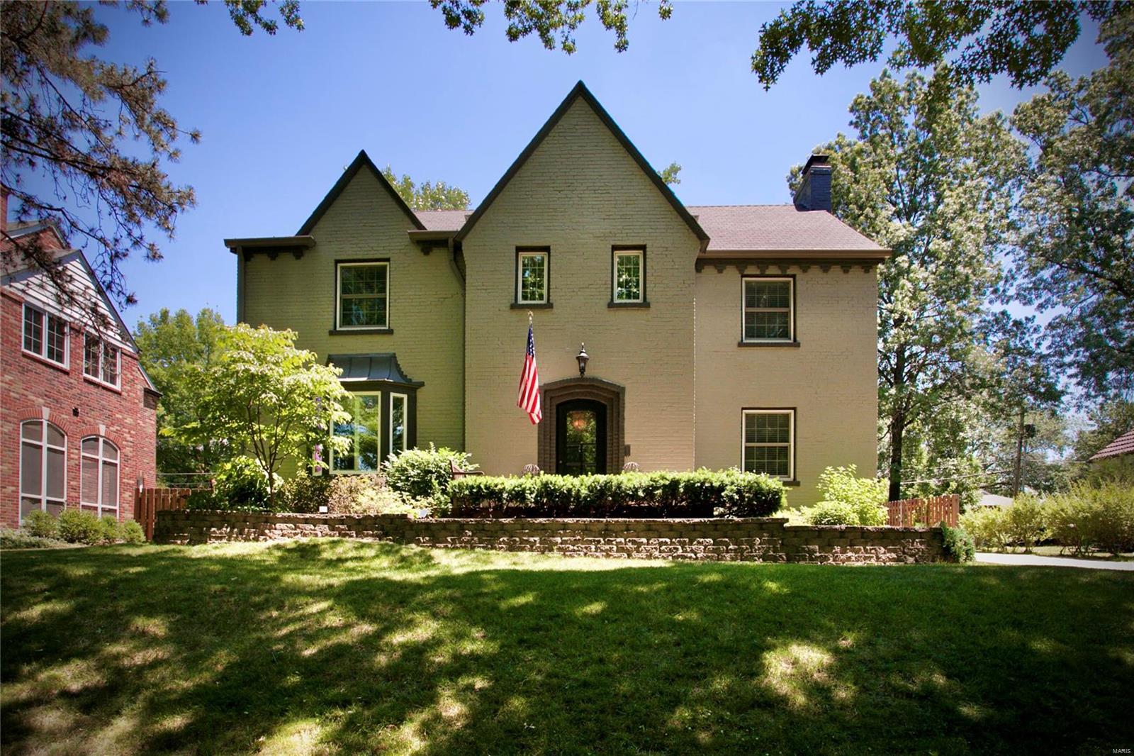 From its gorgeous exterior to its great floor plan, this spectacular 4 bedroom, 3 1/2 bath home in the Moorlands has been thoughtfully expanded and offers the perfect mix of Clayton charm and modern convenience and might check all the boxes on your wish list! Remodeled, eat-in, center island kitchen opens to sunny family room with pretty fireplace and overlooks the patio and fully fenced backyard. Formal living room with fireplace and built-in shelves, formal dining room with bay window, remodeled powder room. Upstairs, you'll find a large master suite with generous closet space, large bath with double vanity, separate tub & shower, and 2nd floor laundry. Three more spacious bedrooms on the second floor, one with en-suite bath, plus a remodeled hall bath. Tons of closet space and storage space throughout! Partially finished lower level with recreation space and/or workout space plus an oversized 2-car garage that really holds two modern cars plus bikes, mower, etc. Perfection!