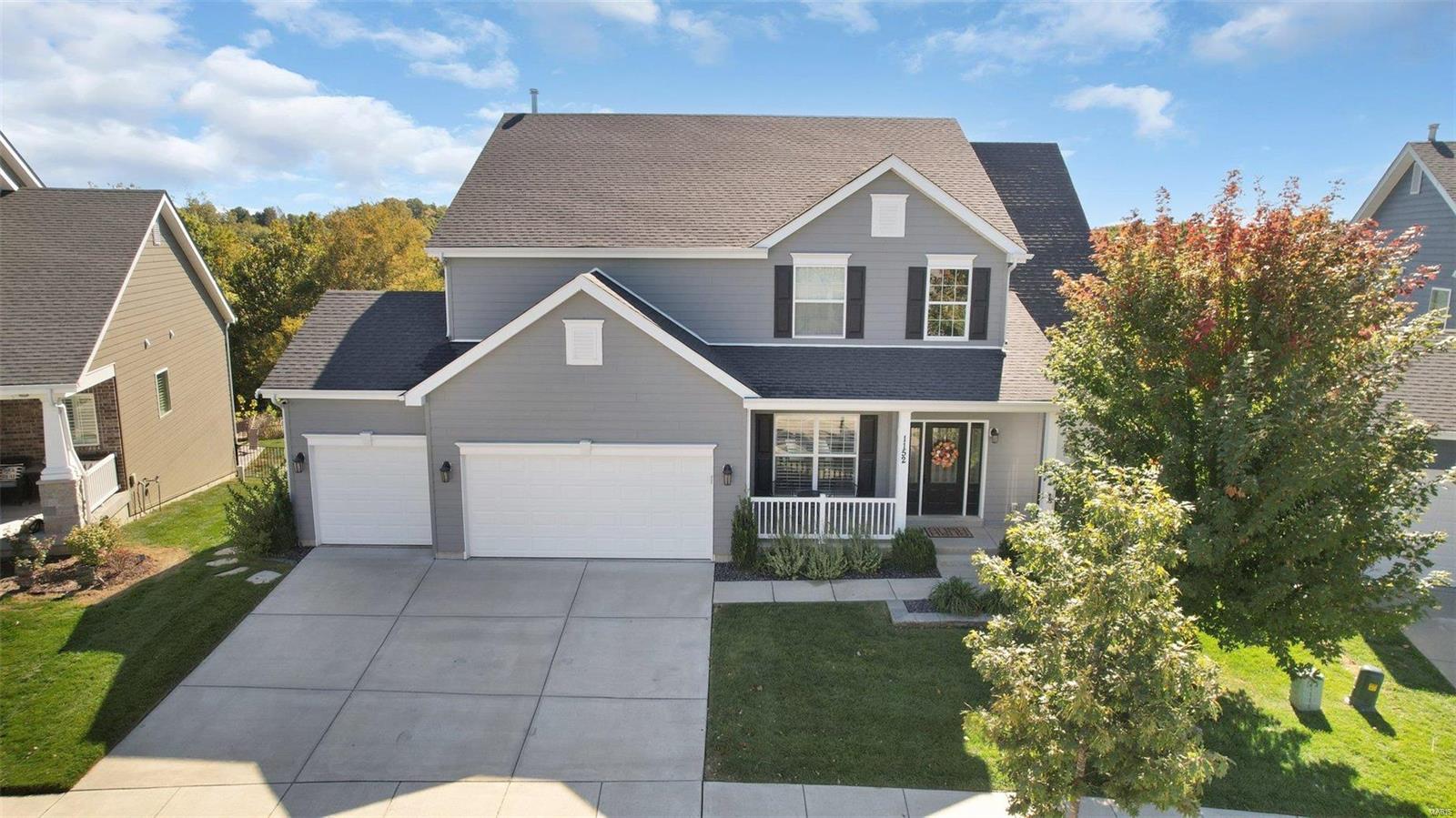 Better than new! This 1.5-story home in Fienup Farms offers exceptional quality and craftsmanship. The upgrades and like-new condition make it special. The expanded floor plan includes additional square footage and soaring ceilings, highlighted by a two-story Great Room. The kitchen is a dream, featuring GE Monogram appliances, lighted cabinetry, tiled backsplash, and a large central island, with access to a screened porch overlooking the private yard backing to wooded common ground. The main-floor master suite boasts a custom walk-in closet and a luxurious master bath. Upstairs, find three spacious bedrooms, two well-appointed bathrooms, walk-in closets, and a huge flexible loft area. Outside, the custom Baker-built swimming pool is seamlessly integrated into the patio, decking, and landscaping. Extra Feature: electric car charger in garage! Enjoy the amenities of Fienup Farms, including walking paths, 26 acre lake, and playgrounds. Located in the most vibrant part of Chesterfield!