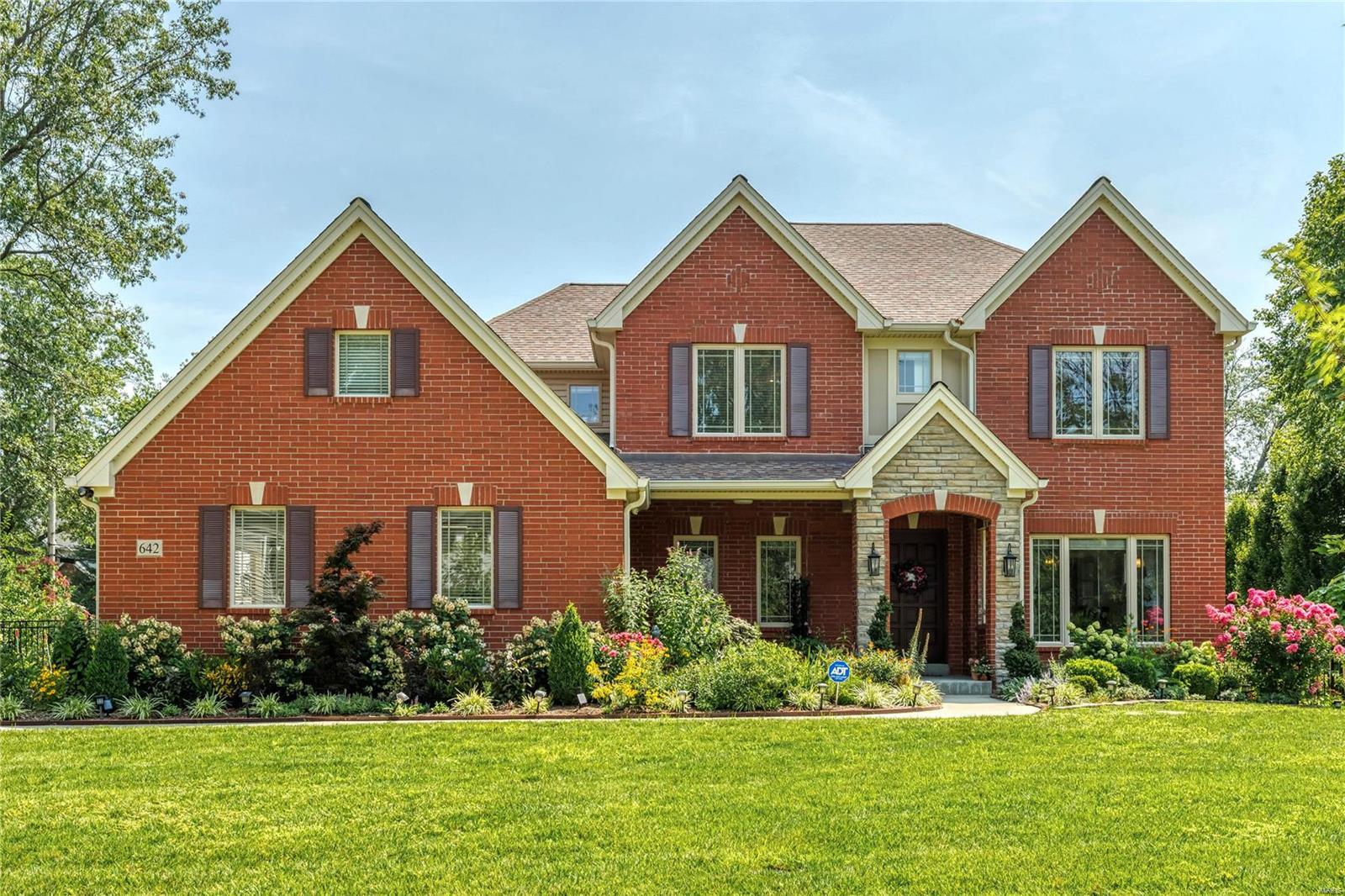 Welcome to this stunning newer custom built, brick/stone, freshly painted 2 story home with 4253 sq ft of living space in a highly sought after Oak Estates neighborhood with Ladue schools. This 5+ bedroom home offers exceptional design features that include a main floor guest bedroom with a full bath, 2nd floor laundry, gorgeous wood flooring on main level, gourmet kitchen with custom cabinets, gas fireplace, finished basement, his/her walk in closets in master bedroom, built in closets in all bedrooms, electric car outlet, 2 HVAC zoned system, Solar panels and higher R-value fiber glass insulation for excellent energy efficiency, in-ground sprinkler system, fenced lot and a beautiful vegetable garden. Enjoy your summer/fall evenings on the outdoor composite deck surrounded by beautiful landscaping and morning walks on the nearby trail connecting to Stacy Park. This house has fabulous upgrades. Please review the list of upgrades that seller made during and after the house was built. Additional Rooms: Mud Room