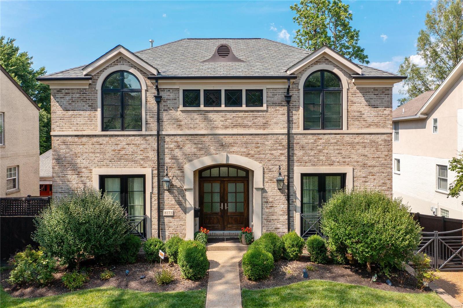 GREAT PRICE REDUCTION. Custom 6 yr NEW construction in popular Clayton Gardens. The seller curated high-end finishes, complimenting an open floorplan accented by 9 & 10 ft ceilings.   A 12 ft granite island accents the cook’s kitchen with amenities including subzero, Viking range and Miele built in coffee maker.  The breakfast rm, and lg fam/great rm with fireplace accesses the maintenance free deck with fireplace. A powder rm, liv/offc, and dining rm complete the 1stflr.  A luxury master suite with timeless marble, glass shower, air tub, double vanities and huge custom closet, along with 3 add’l suites, each with private bath/lg walk in custom closets and a laundry rm are all found on the 2nd flr.  The low lev WALKS OUT to a private covered patio and fenced yard.  A 5th bedrm, full bath, rec rm with wet bar, mudrm and craft rm complete the low lev.  An electronic gate for the heated driveway, lg 2 car gar, and so many more upgrades.  Walk to downtown and Clayton school. Additional Rooms: Mud Room